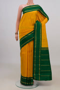 Pure Silk Pure Zari Yellow Kanjivaram Saree with Plain Body and Zari Border.  displayed on a mannequin