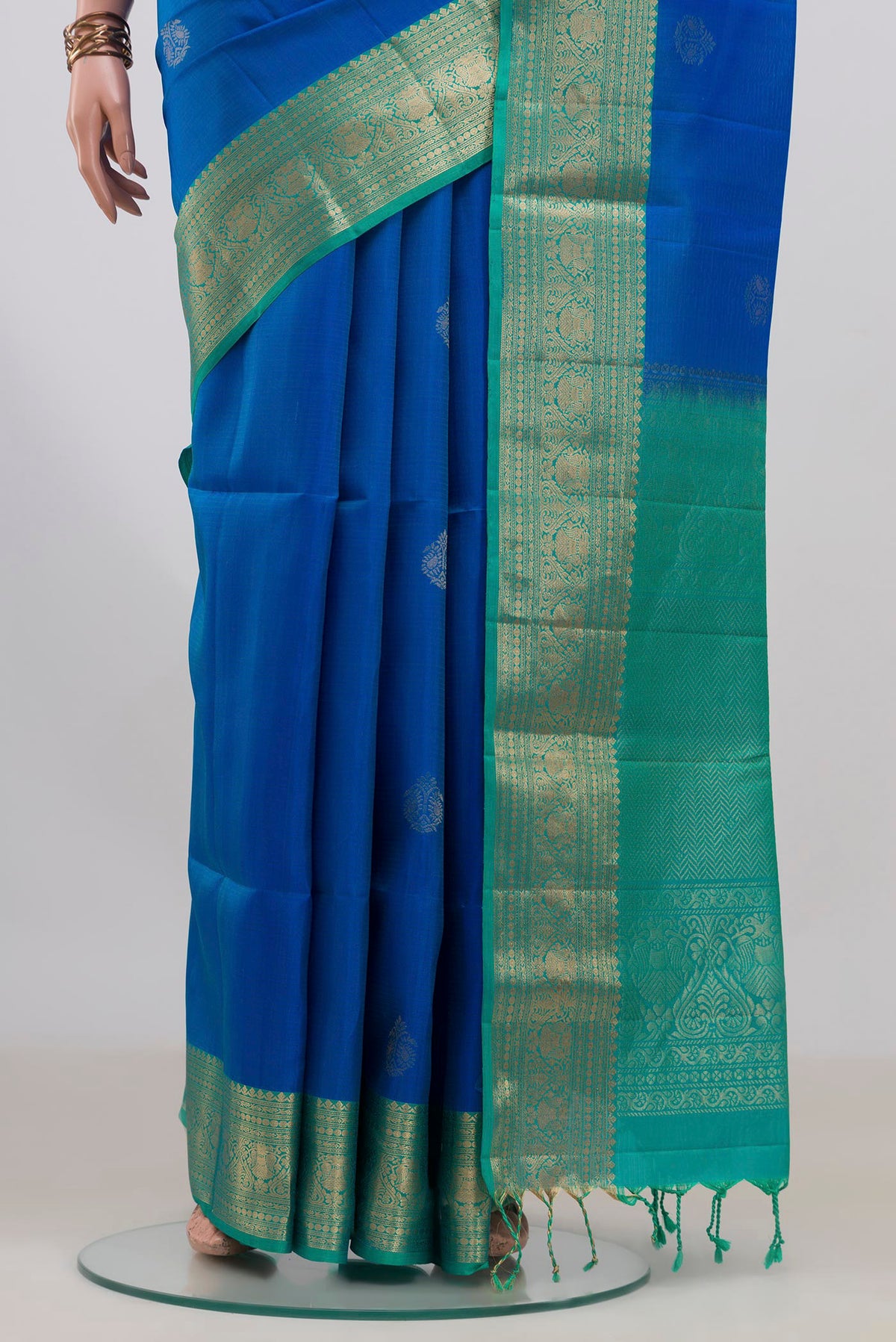 Pleats and pallu of Pure Silk Royal Blue Soft Saree with Zari Butta on the body and Zari Border. 