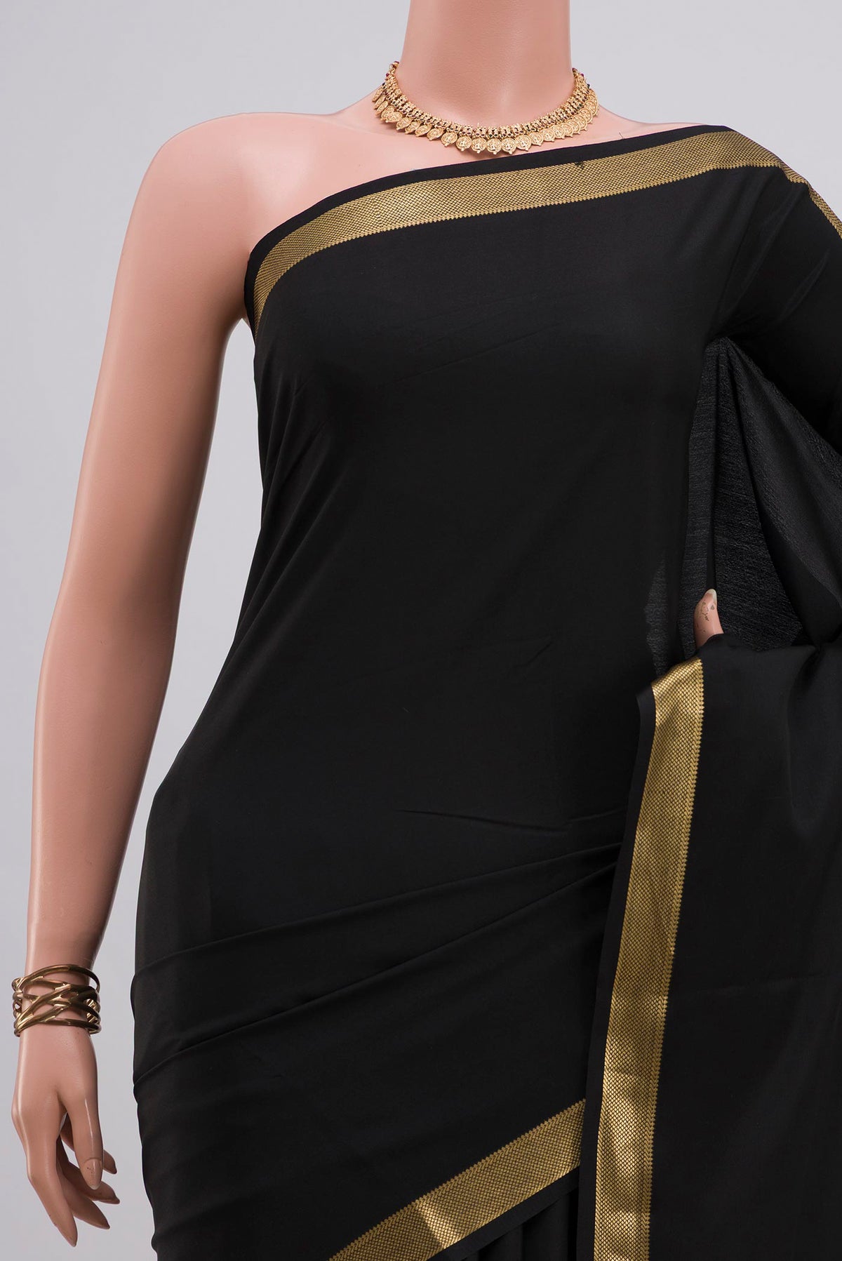 Border image of Black Crepe Saree with Plain Body and Zari Border. 