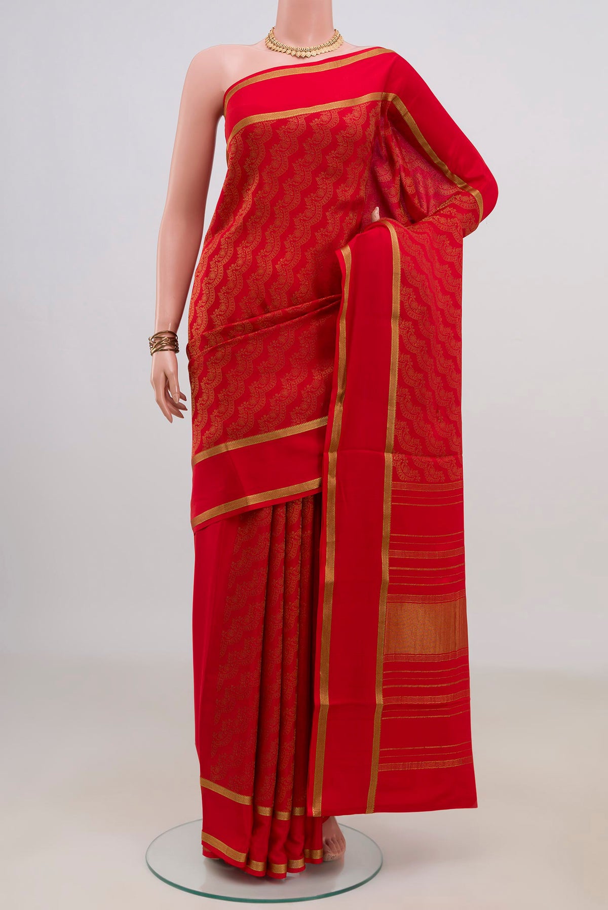 Red Mysore Crepe Saree with Zari Brocade on the body and Zari Border.  displayed on a mannequin