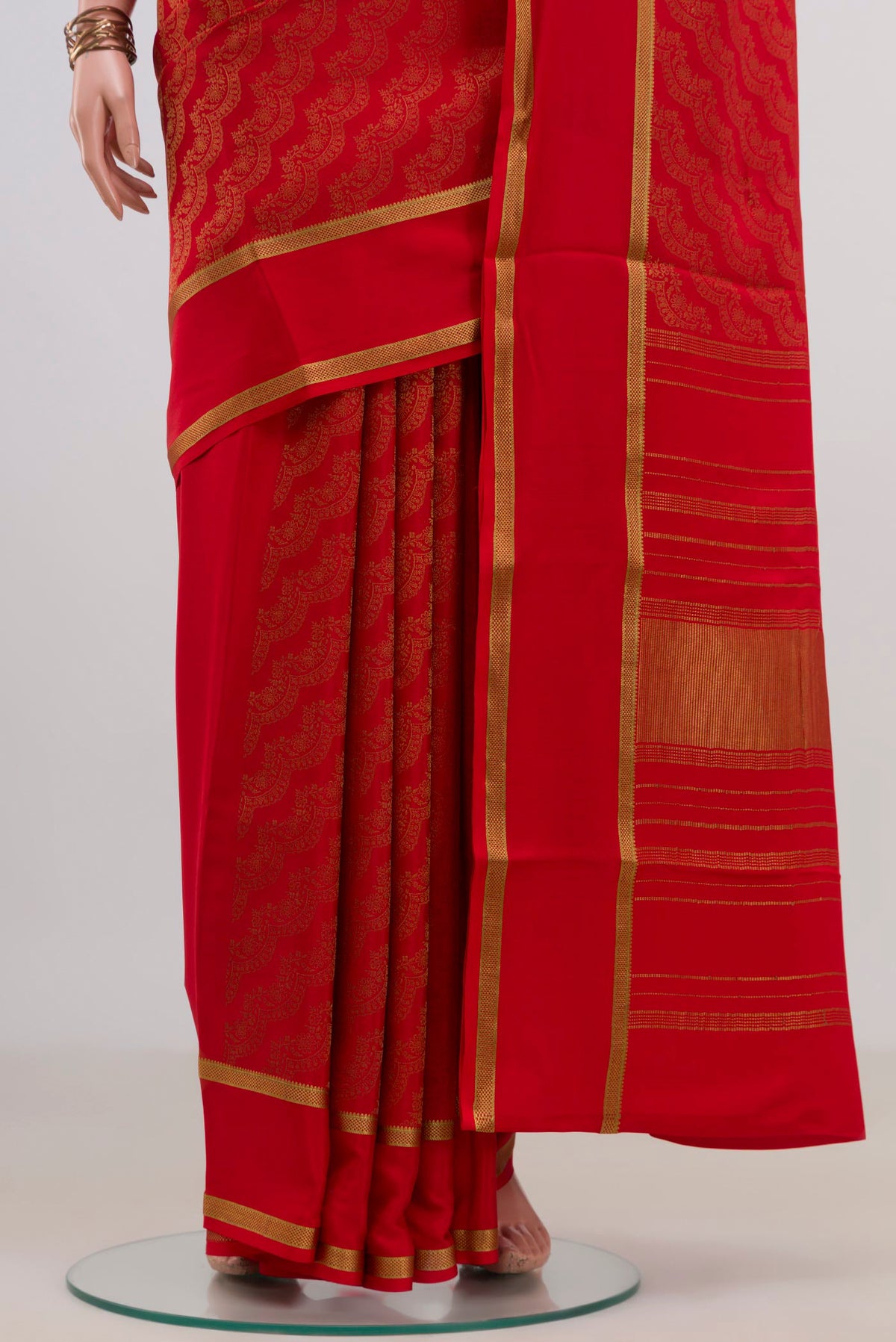Pleats and pallu of Red Mysore Crepe Saree with Zari Brocade on the body and Zari Border. 