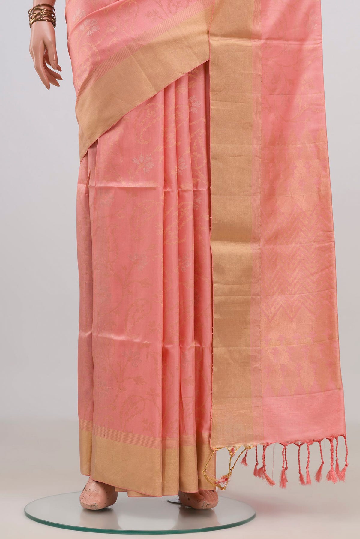 Pleats and pallu of Pure Silk Peach Soft Saree with Stripes on the body and Zari Border. 