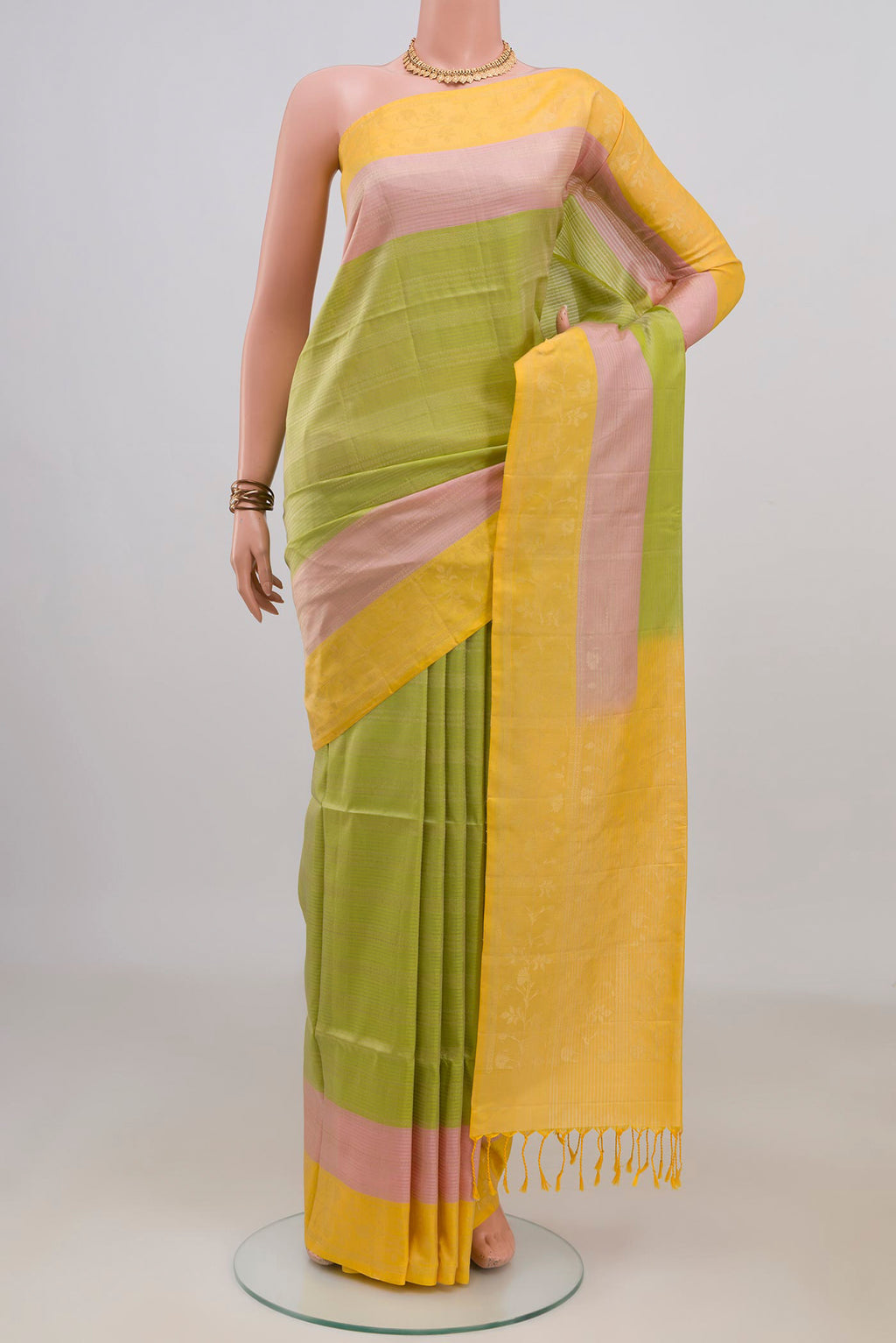 Pure Silk Light Green Soft Saree with Stripes on the body and Plain Border.  displayed on a mannequin