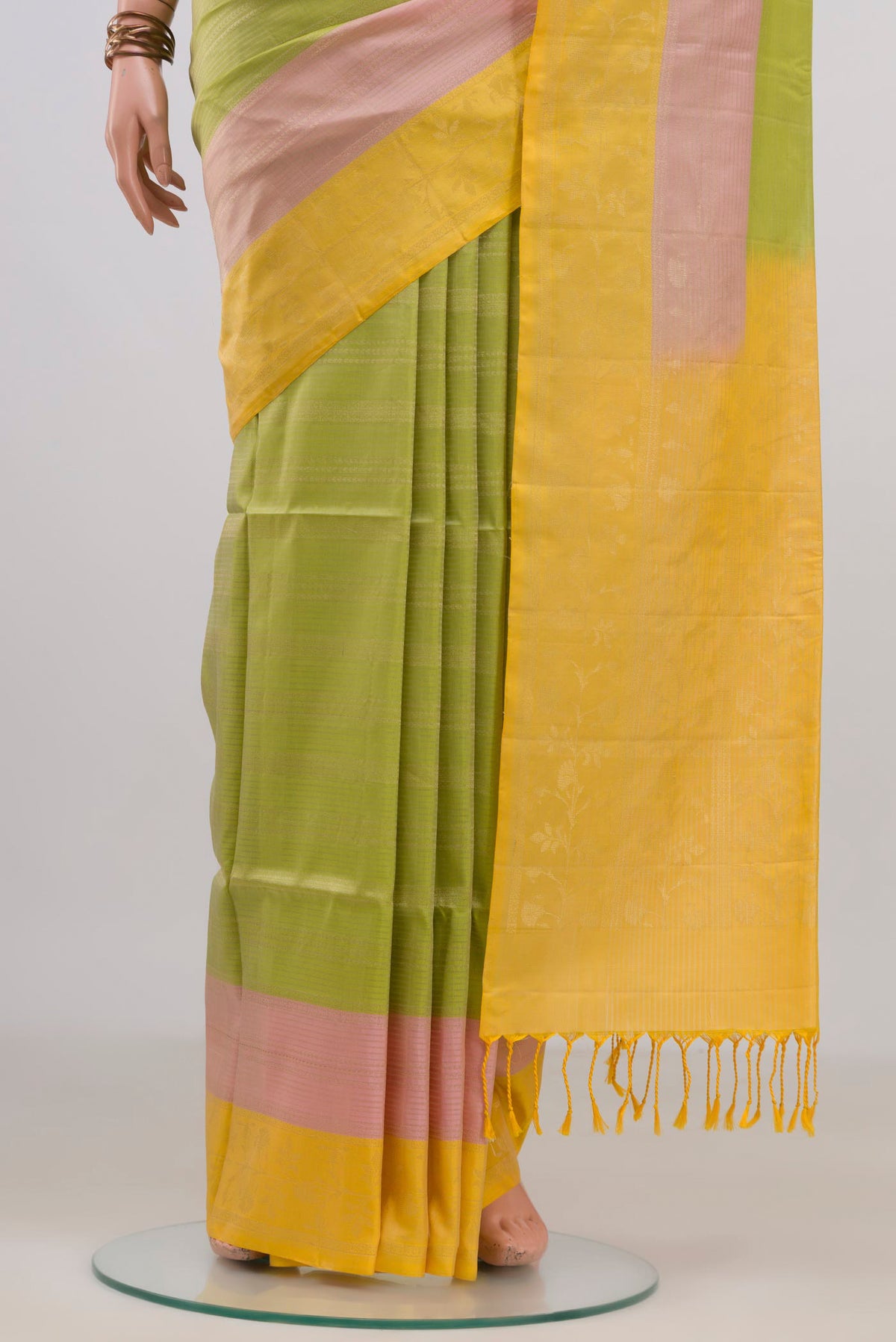 Pleats and pallu of Pure Silk Light Green Soft Saree with Stripes on the body and Plain Border. 