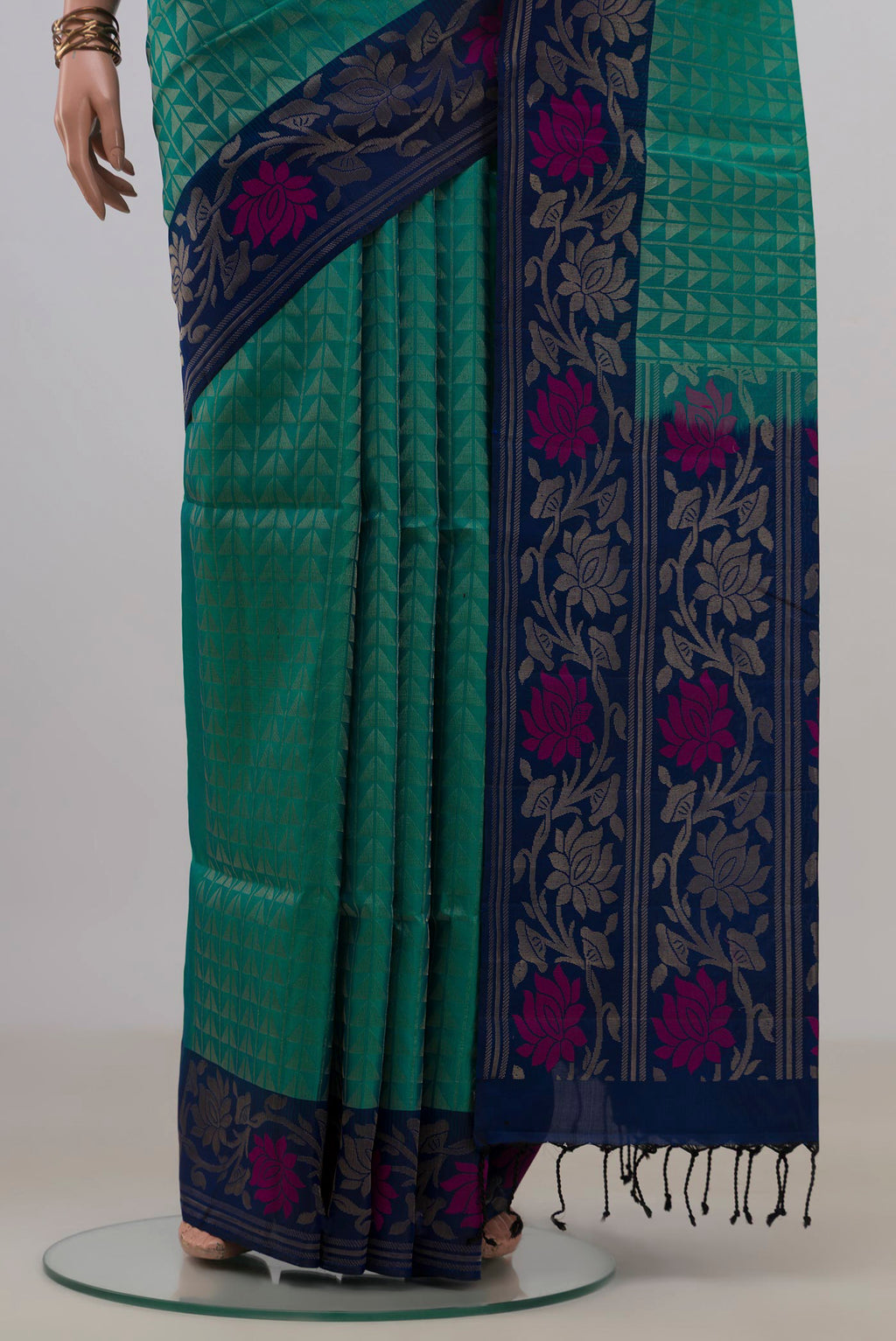 Pleats and pallu of Pure Silk Green Soft Saree with Fancy on the body and Fancy Border. 