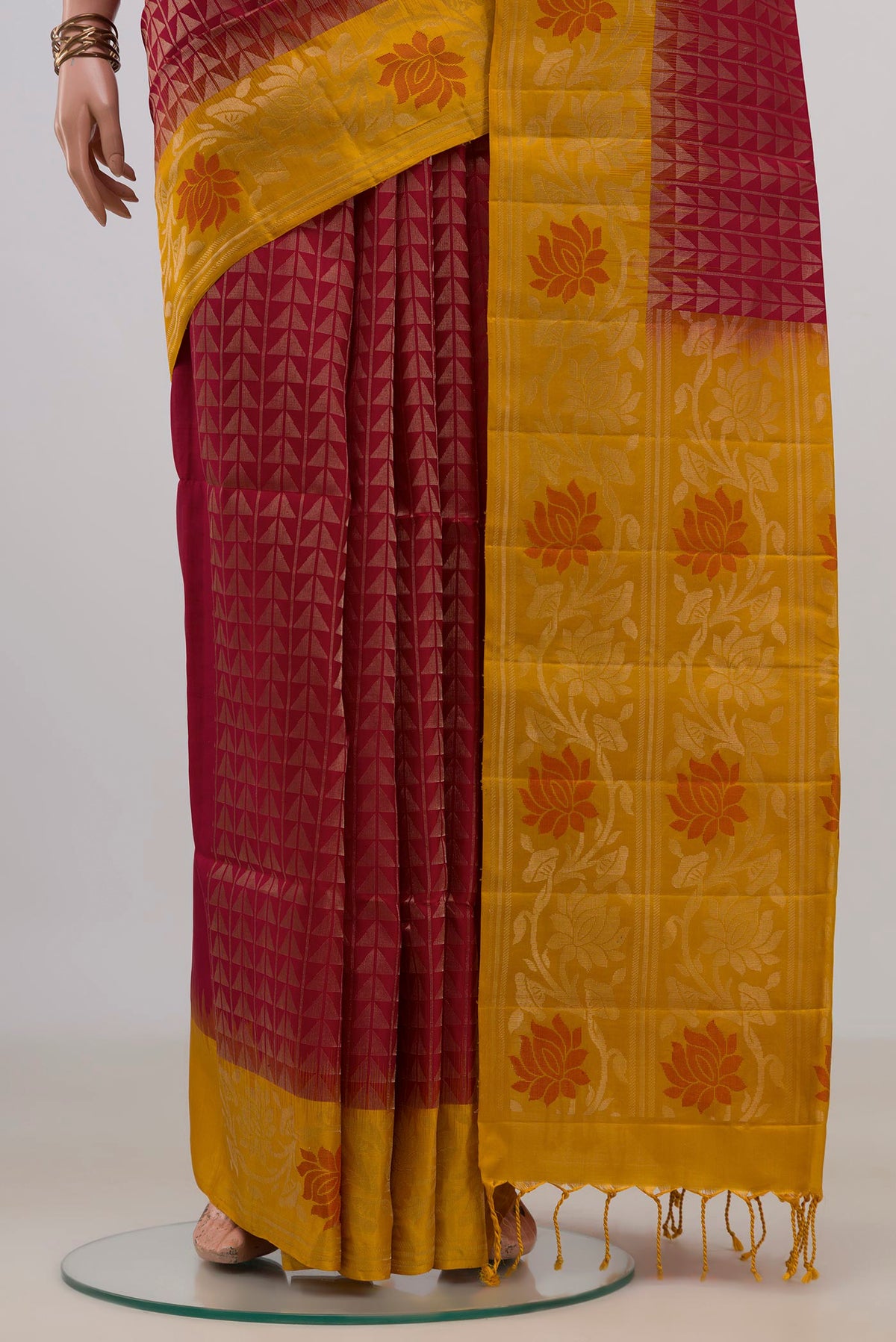 Pleats and pallu of Pure Silk Red Soft Saree with Fancy on the body and Fancy Border. 