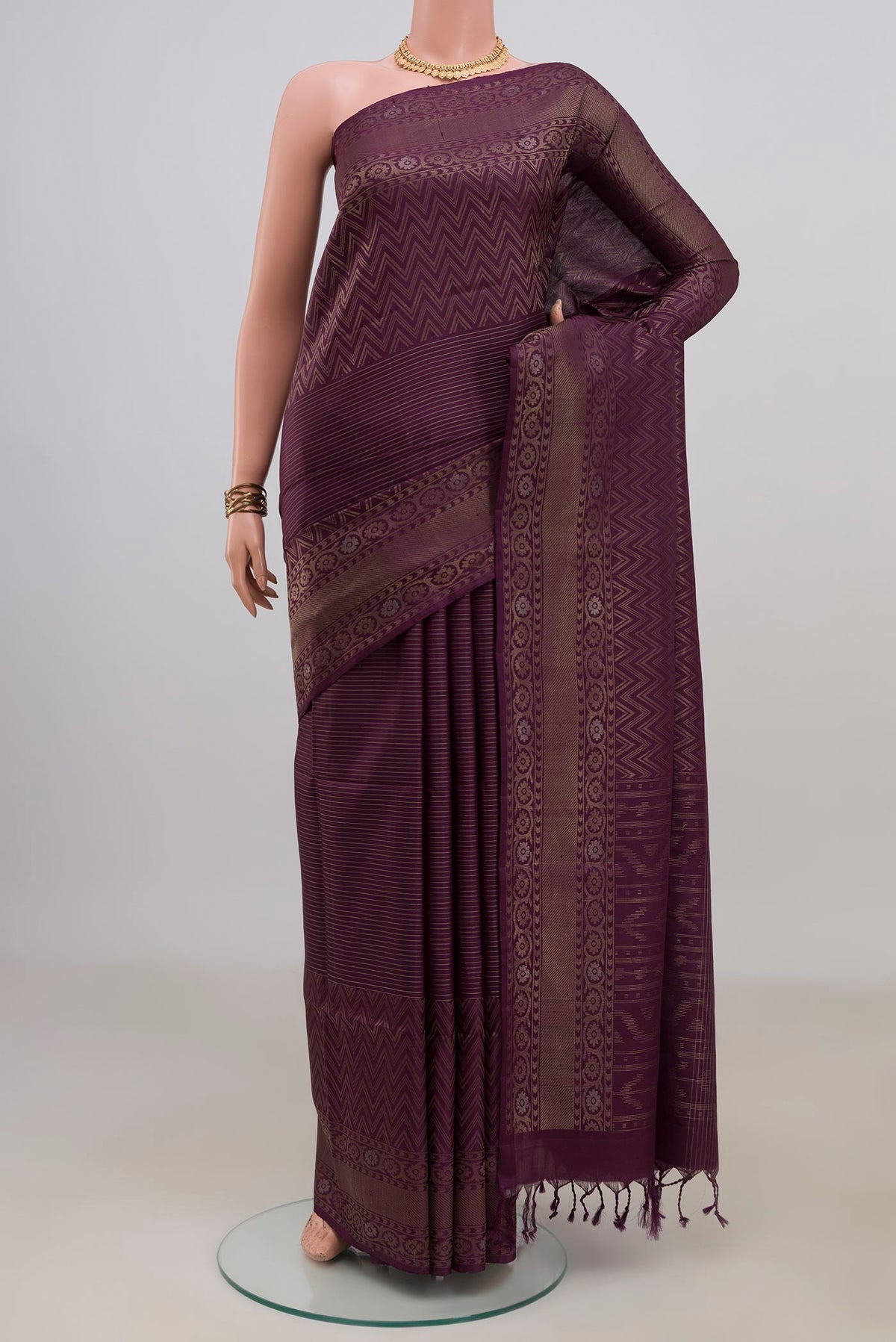 Pure Silk Purple Soft Saree with Stripes on the body and Fancy Border.  displayed on a mannequin