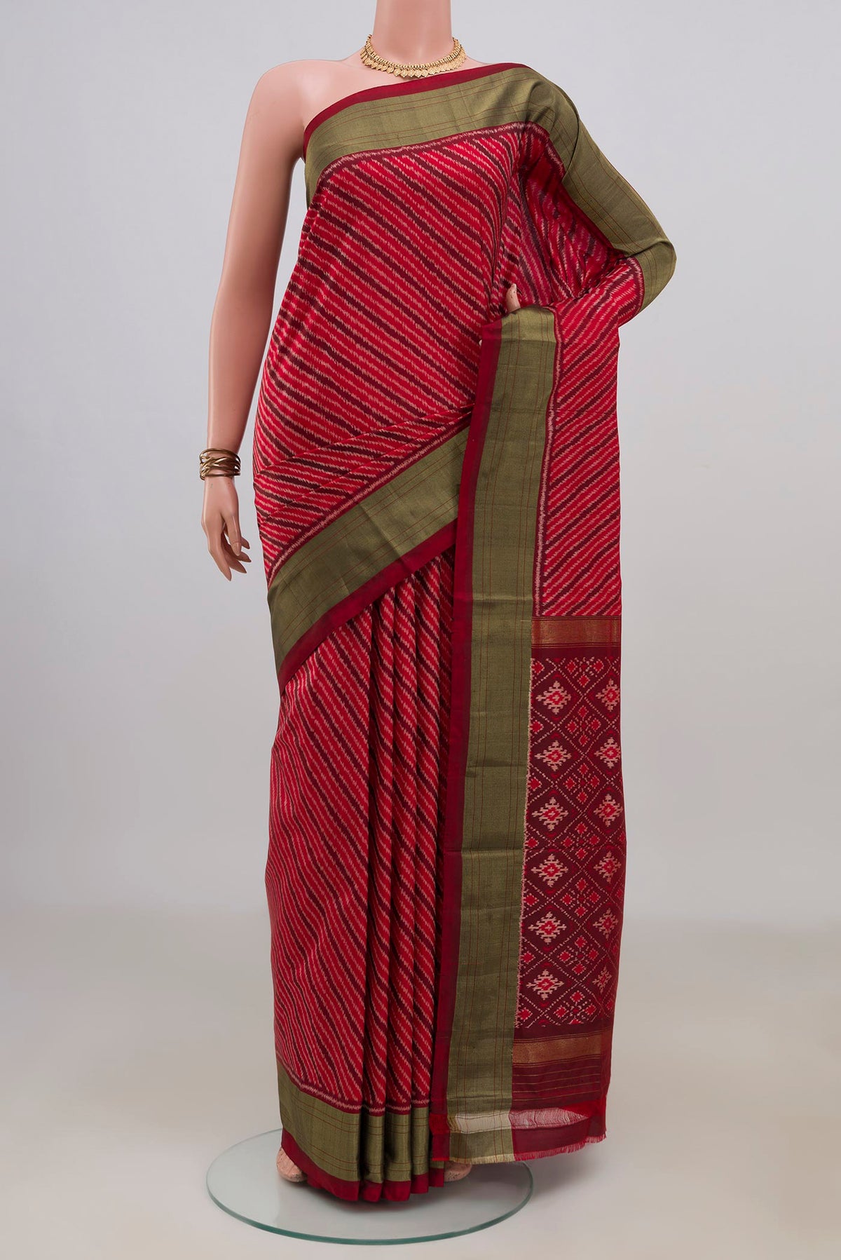Pure Silk Red Pochampally Saree with Ikat design on the body and Zari Border.  displayed on a mannequin