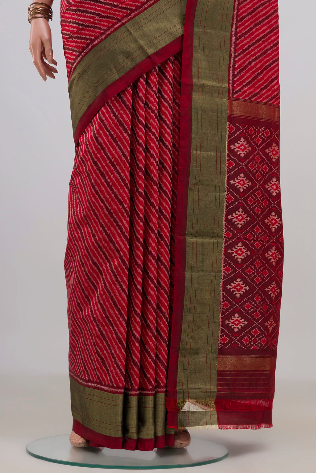 Pleats and pallu of Pure Silk Red Pochampally Saree with Ikat design on the body and Zari Border. 