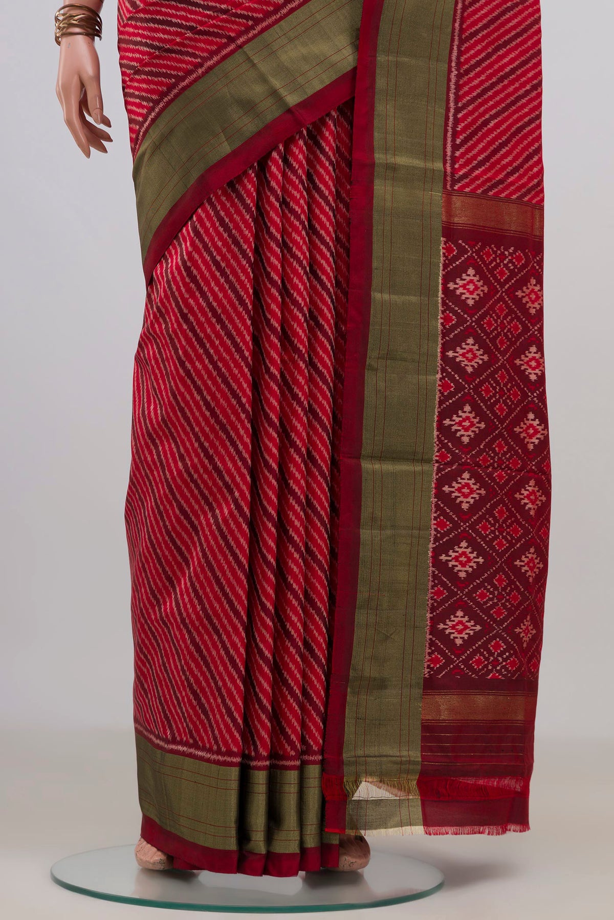 Pleats and pallu of Pure Silk Red Pochampally Saree with Ikat design on the body and Zari Border. 
