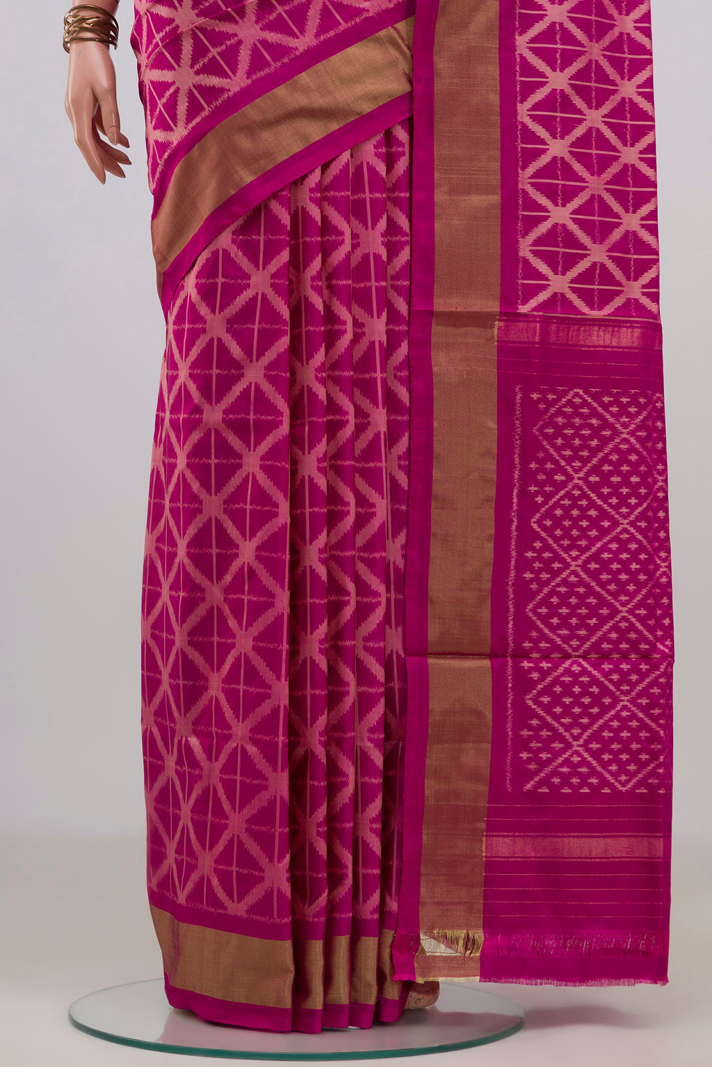 Pleats and pallu of Pure Silk Magenta Pochampally Saree with Ikat design on the body and Zari Border. 