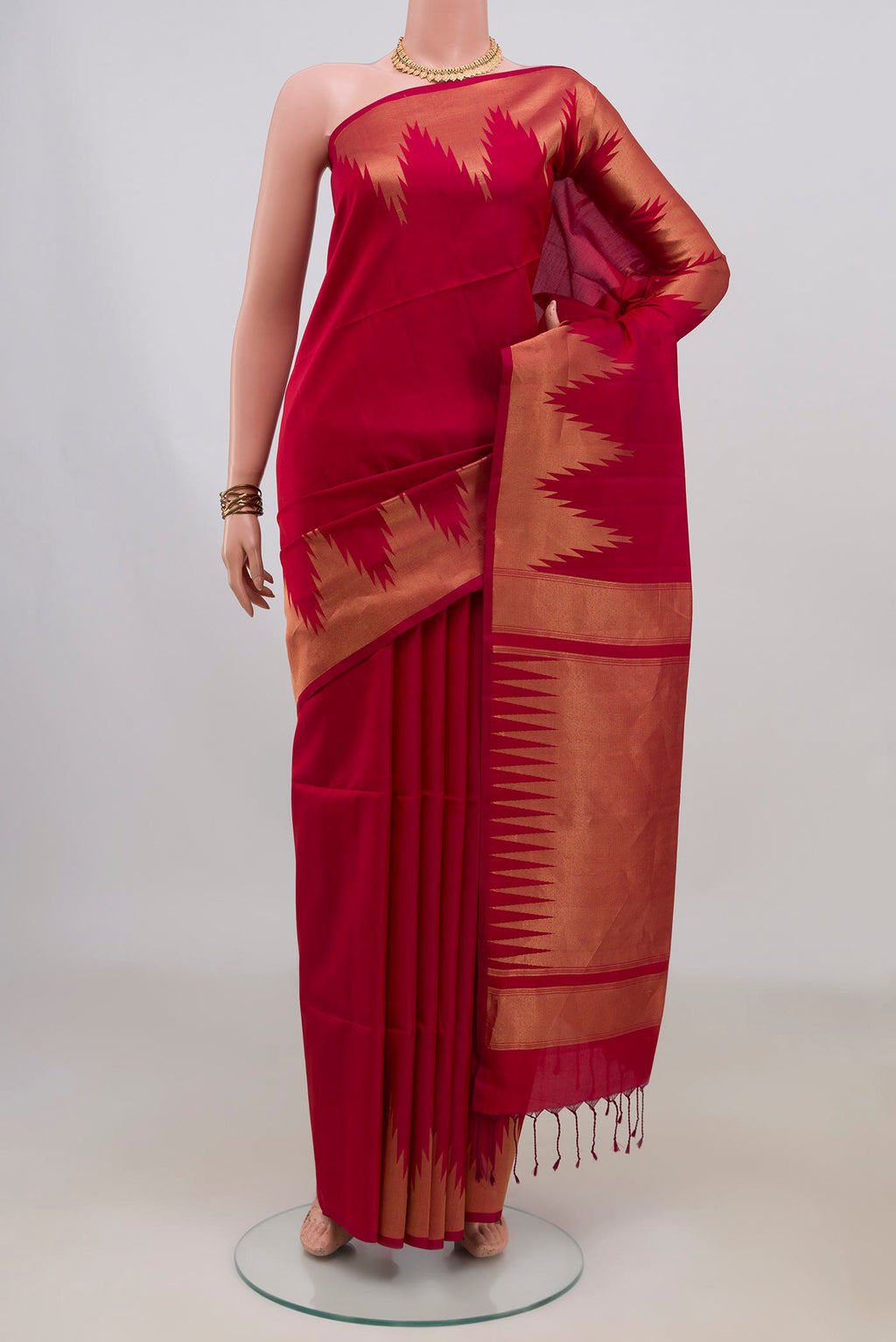 Pure Silk Maroon Soft Saree with Plain Body and Temple Border.  displayed on a mannequin