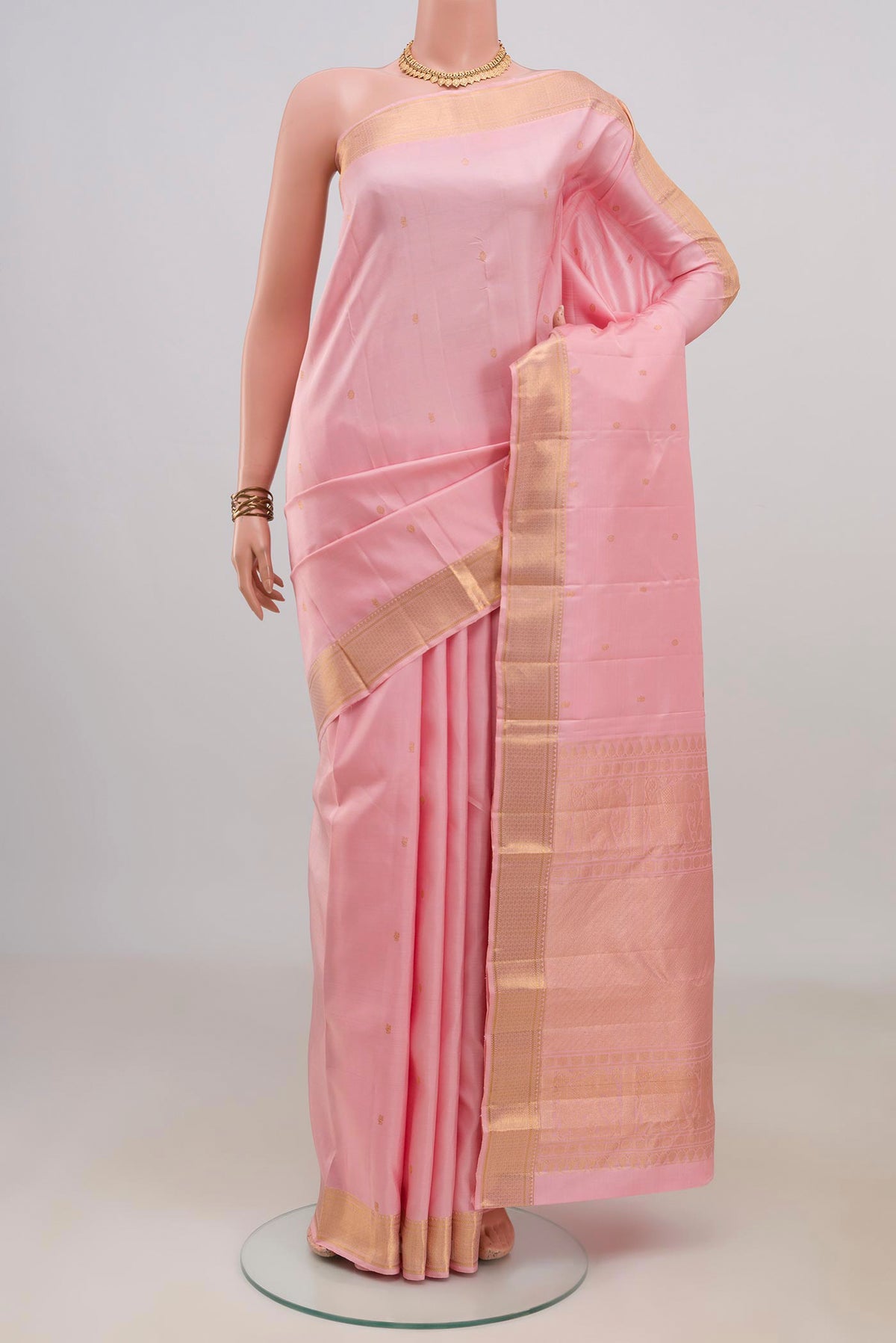 Pure Silk Rose pink Kanjivaram Saree with Zari Butta on the body and Zari Border.  displayed on a mannequin