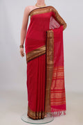 Red Silk Cotton Saree with Checked design on the body and Zari Border.  displayed on a mannequin