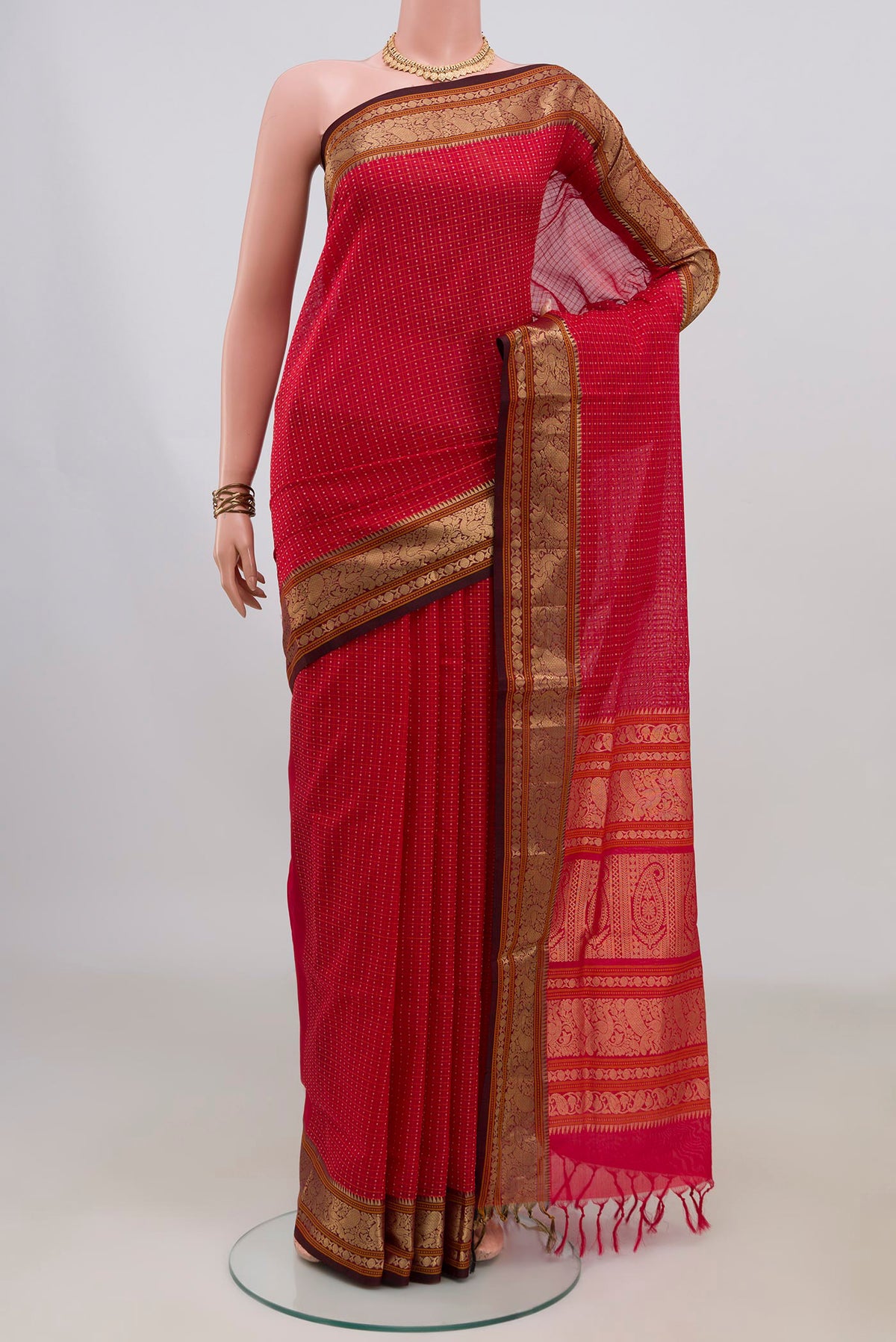 Red Silk Cotton Saree with Checked design on the body and Zari Border.  displayed on a mannequin