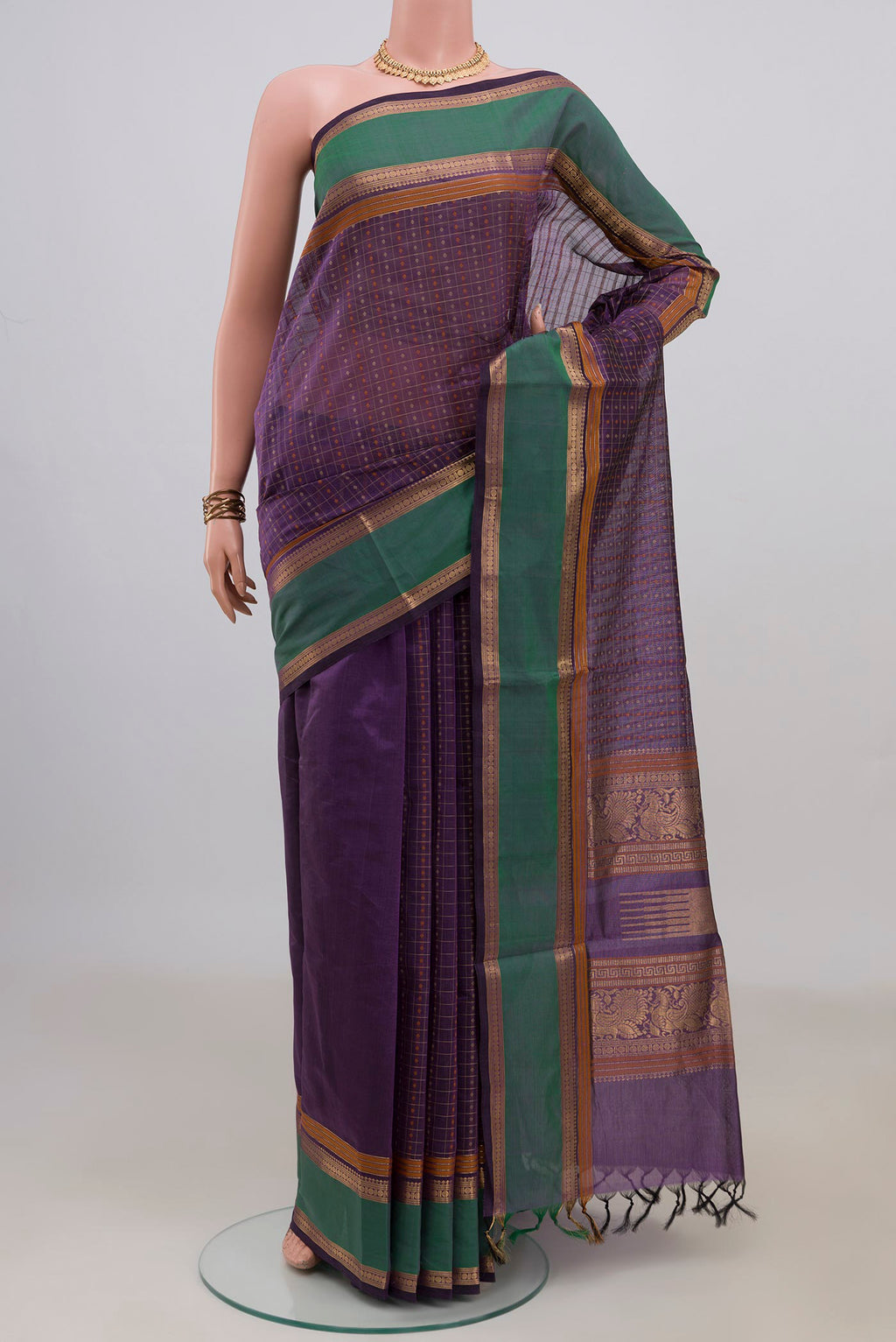 Purple Silk Cotton Saree with Checked design on the body and Zari Border.  displayed on a mannequin