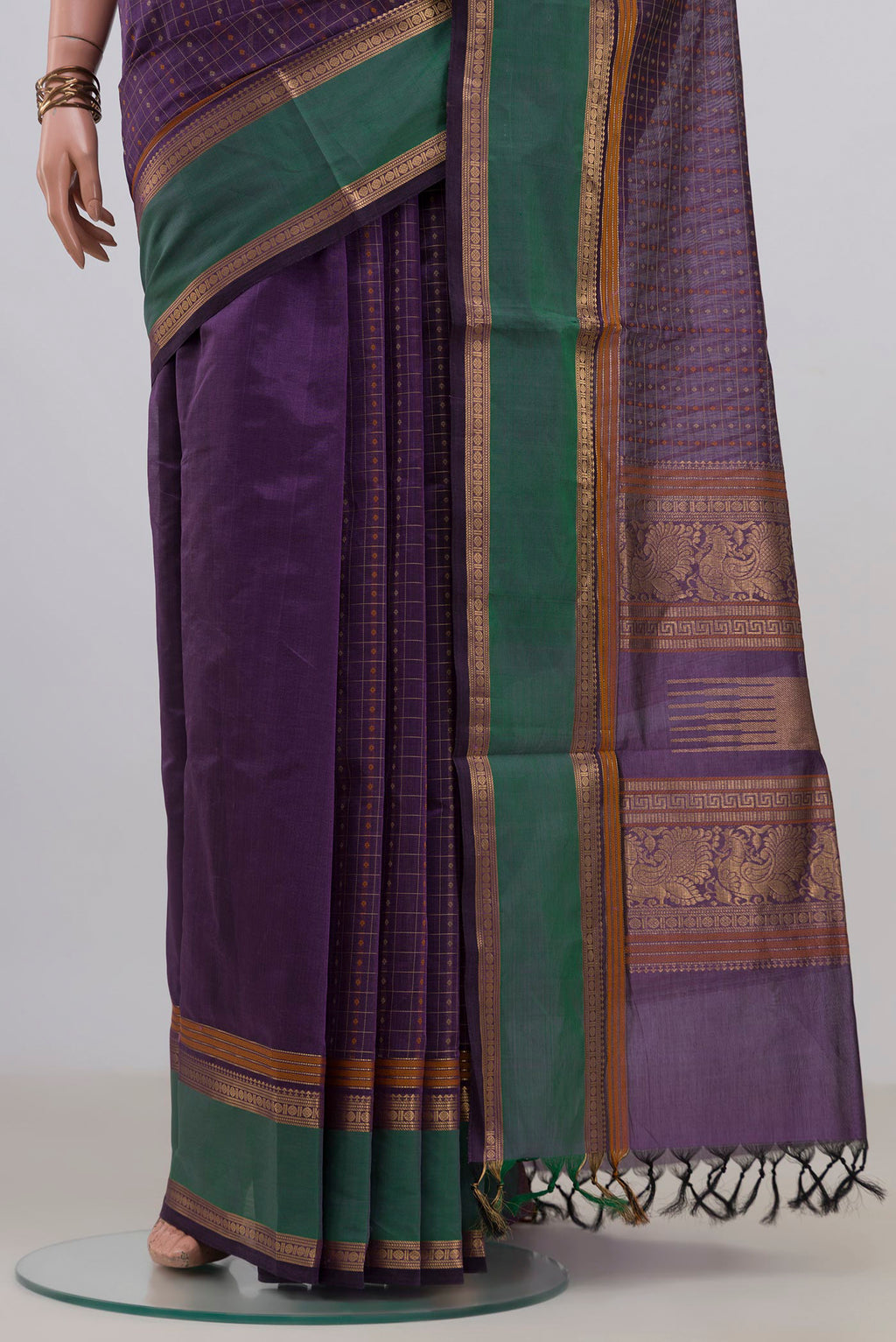 Pleats and pallu of Purple Silk Cotton Saree with Checked design on the body and Zari Border. 