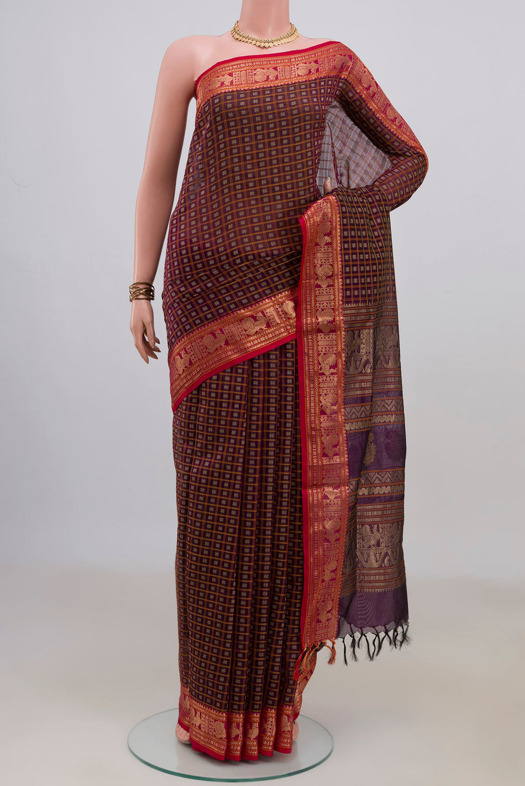 Purple Silk Cotton Saree with Checked design on the body and Zari Border.  displayed on a mannequin