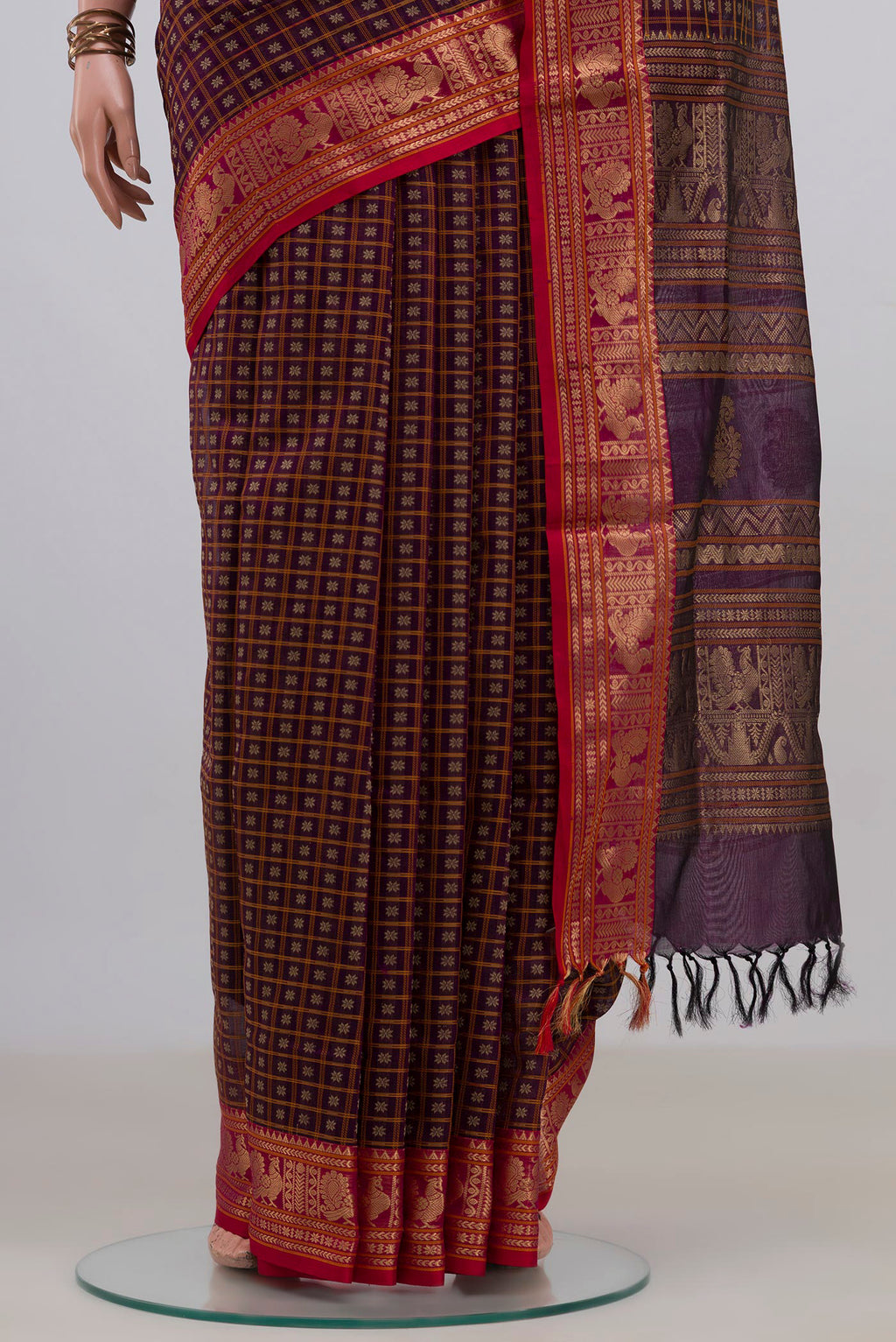 Pleats and pallu of Purple Silk Cotton Saree with Checked design on the body and Zari Border. 