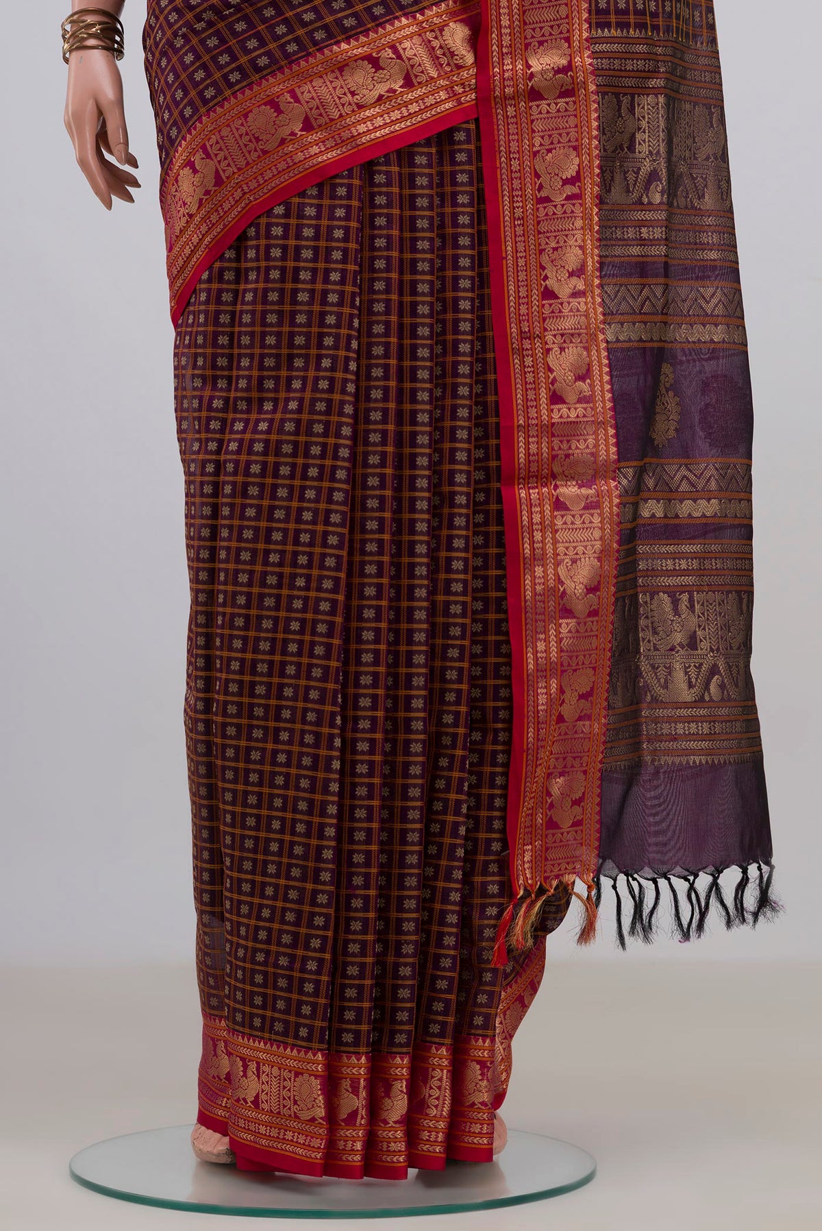 Pleats and pallu of Purple Silk Cotton Saree with Checked design on the body and Zari Border. 