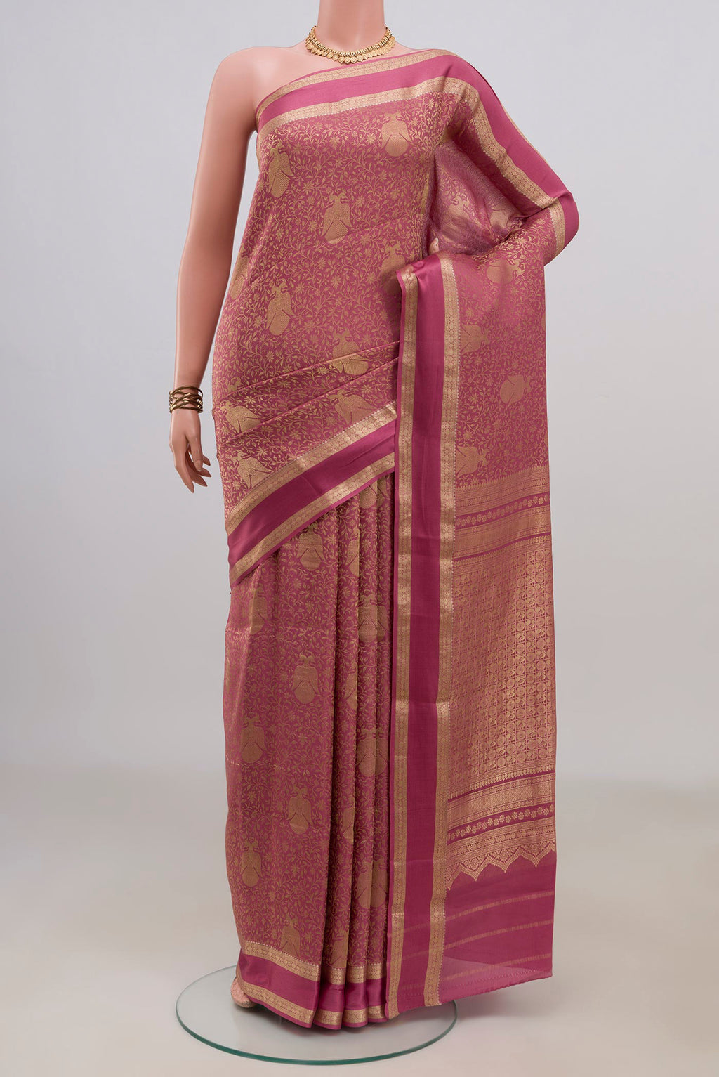 Pink Mysore Crepe Saree with Zari Brocade on the body and Zari Border.  displayed on a mannequin