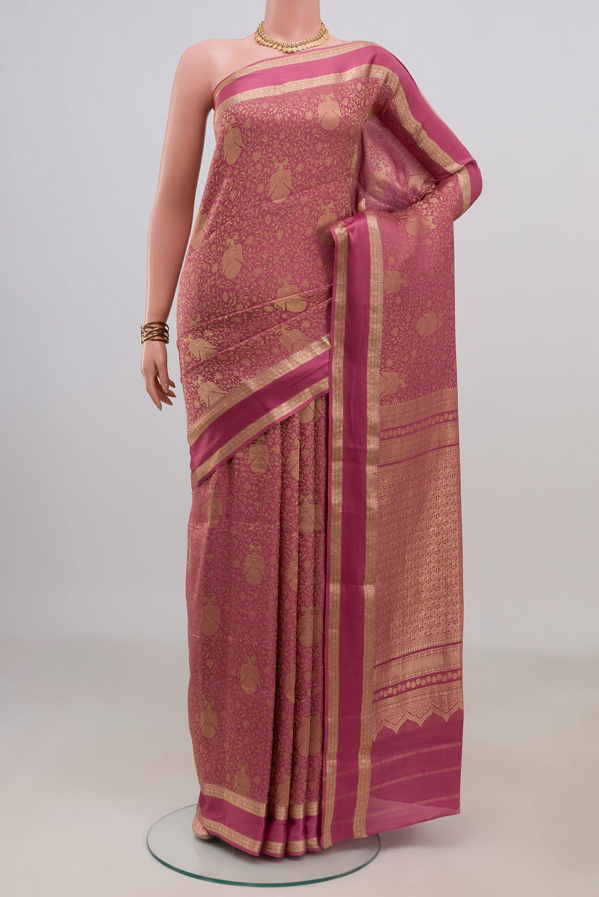 Pink Mysore Crepe Saree with Zari Brocade on the body and Zari Border.  displayed on a mannequin