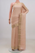 Peach Mysore Crepe Saree with Zari Brocade on the body and Zari Border.  displayed on a mannequin