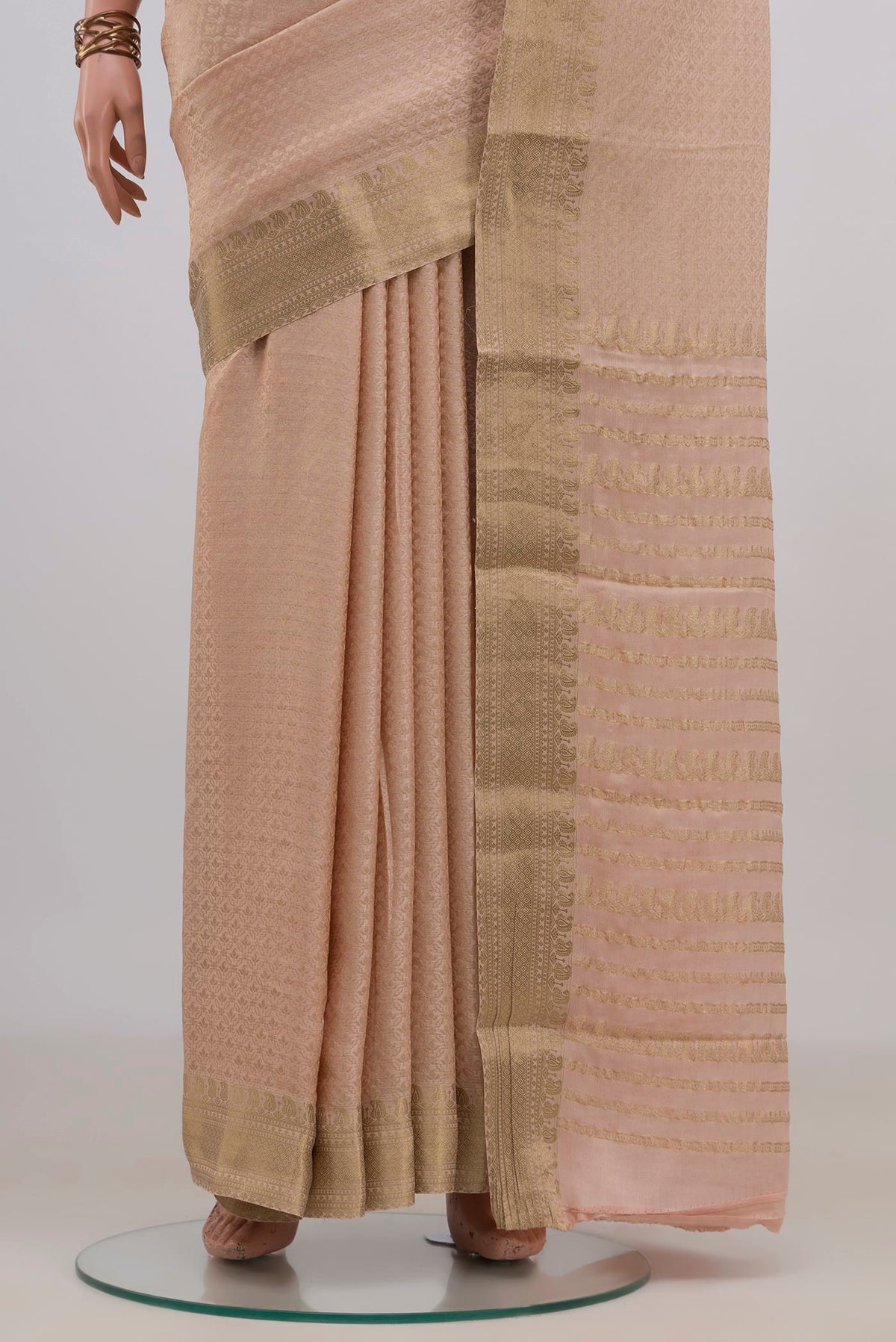 Pleats and pallu of Peach Mysore Crepe Saree with Zari Brocade on the body and Zari Border. 