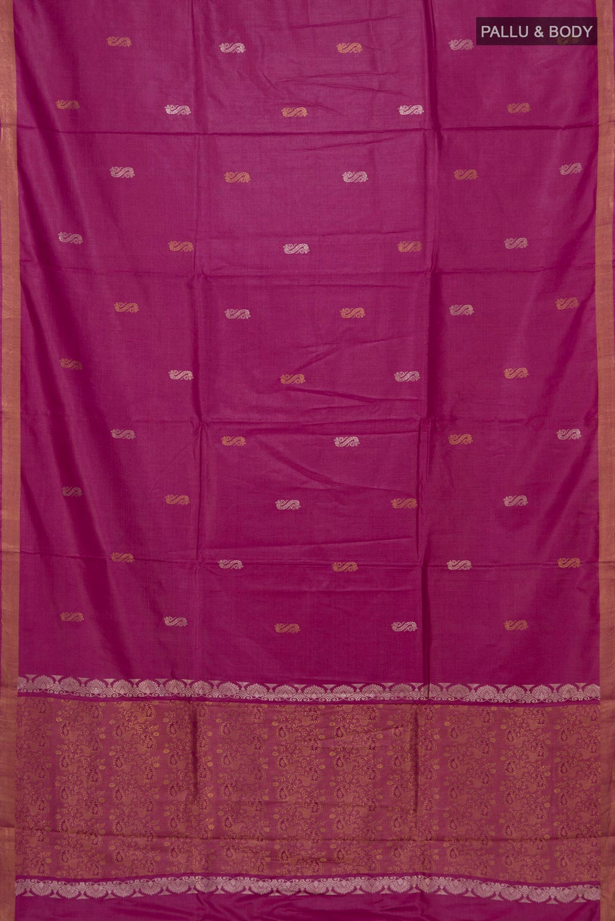 Flat view of Magenta Tussar Saree with Zari Butta on the body and Zari Border. 
