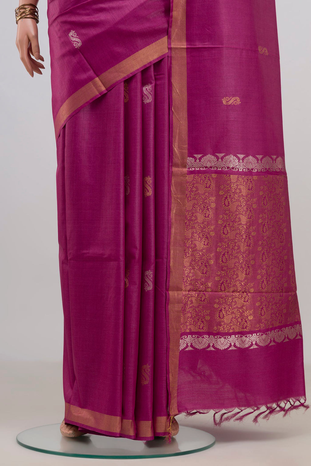 Pleats and pallu of Magenta Tussar Saree with Zari Butta on the body and Zari Border. 