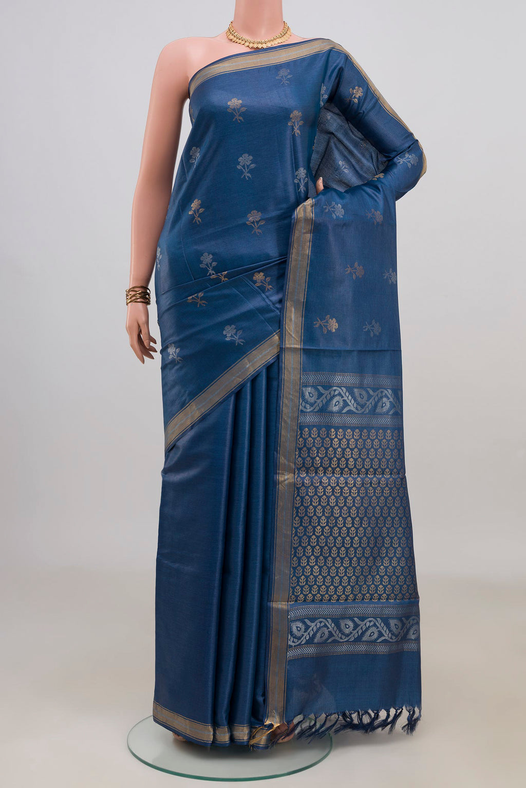 Blue Tussar Saree with Zari Butta on the body and Zari Border.  displayed on a mannequin