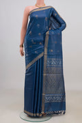 Blue Tussar Saree with Zari Butta on the body and Zari Border.  displayed on a mannequin