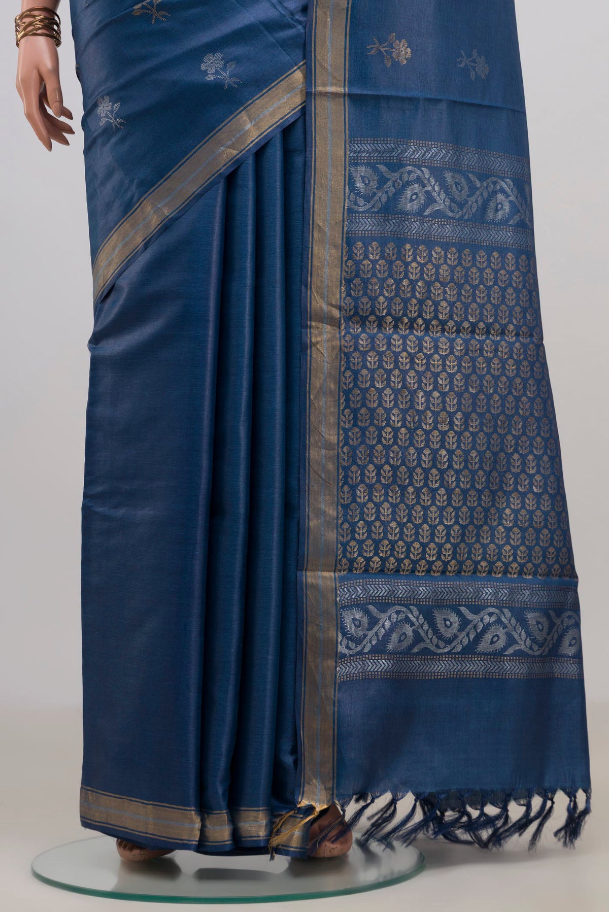 Pleats and pallu of Blue Tussar Saree with Zari Butta on the body and Zari Border. 