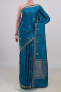 Blue Tussar Saree with Zari Butta on the body and Zari Border.  displayed on a mannequin
