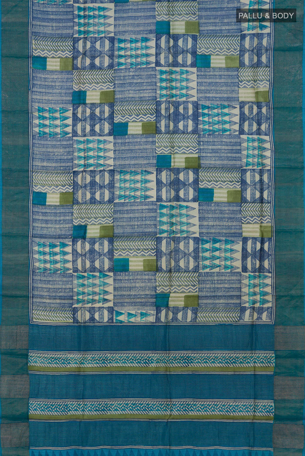 Flat view of Multi Color Tussar Saree with Printed design on the body and Zari Border. 