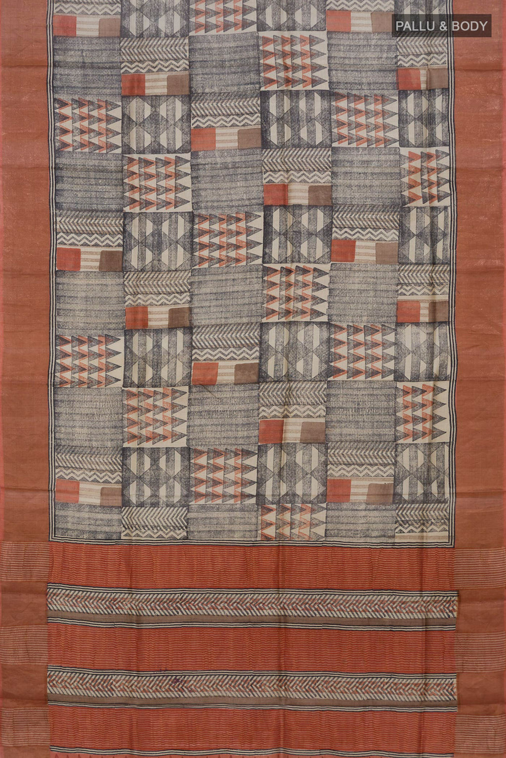 Flat view of Multi Color Tussar Saree with Printed design on the body and Zari Border. 
