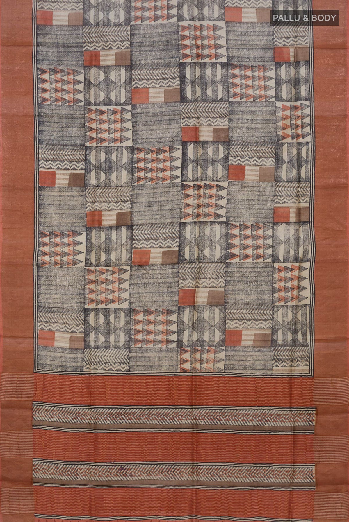 Flat view of Multi Color Tussar Saree with Printed design on the body and Zari Border. 