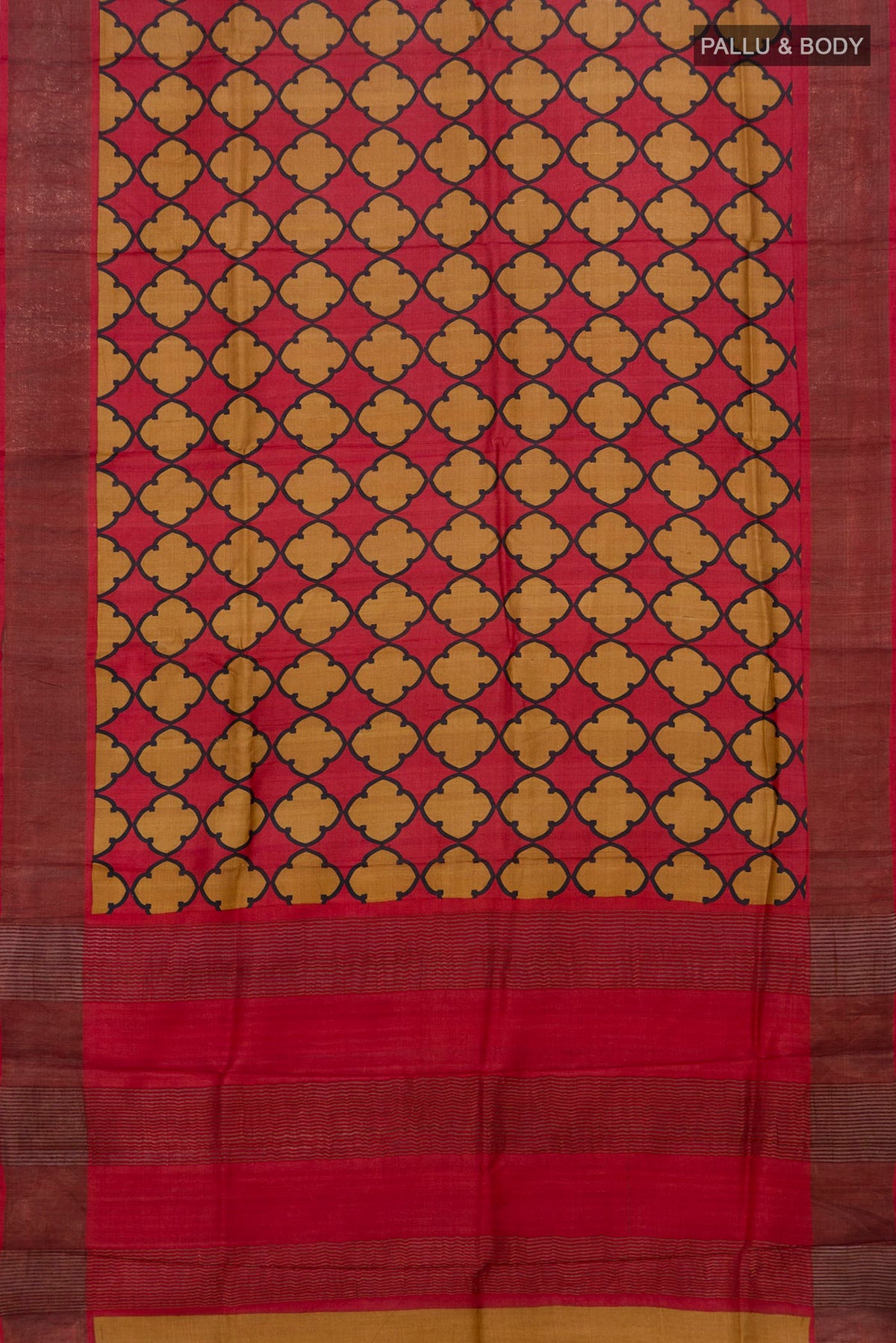 Flat view of Red Tussar Saree with Printed design on the body and Zari Border. 