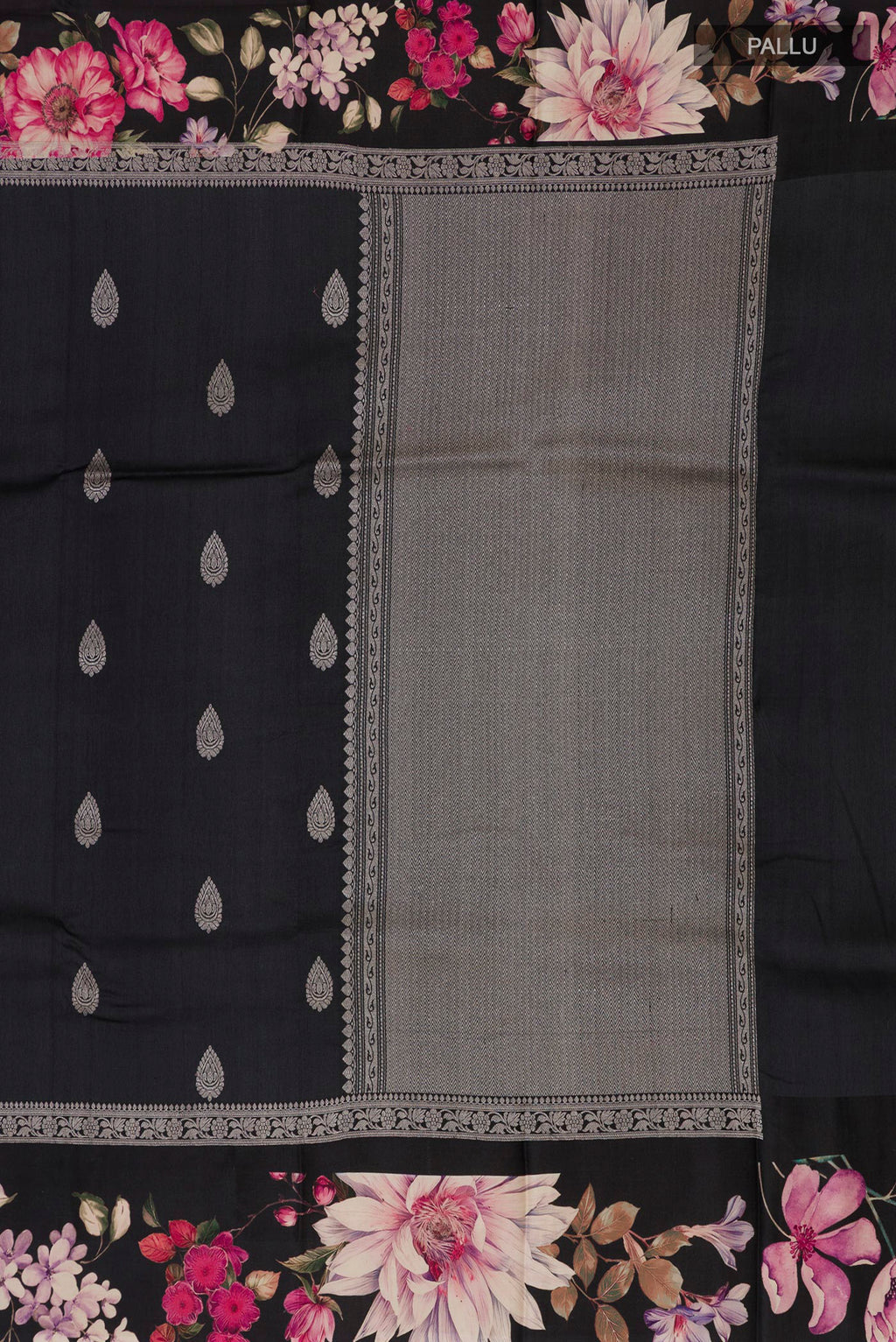 Close up image of the pallu of Black Tussar Saree with Zari Butta on the body and Fancy Border. 