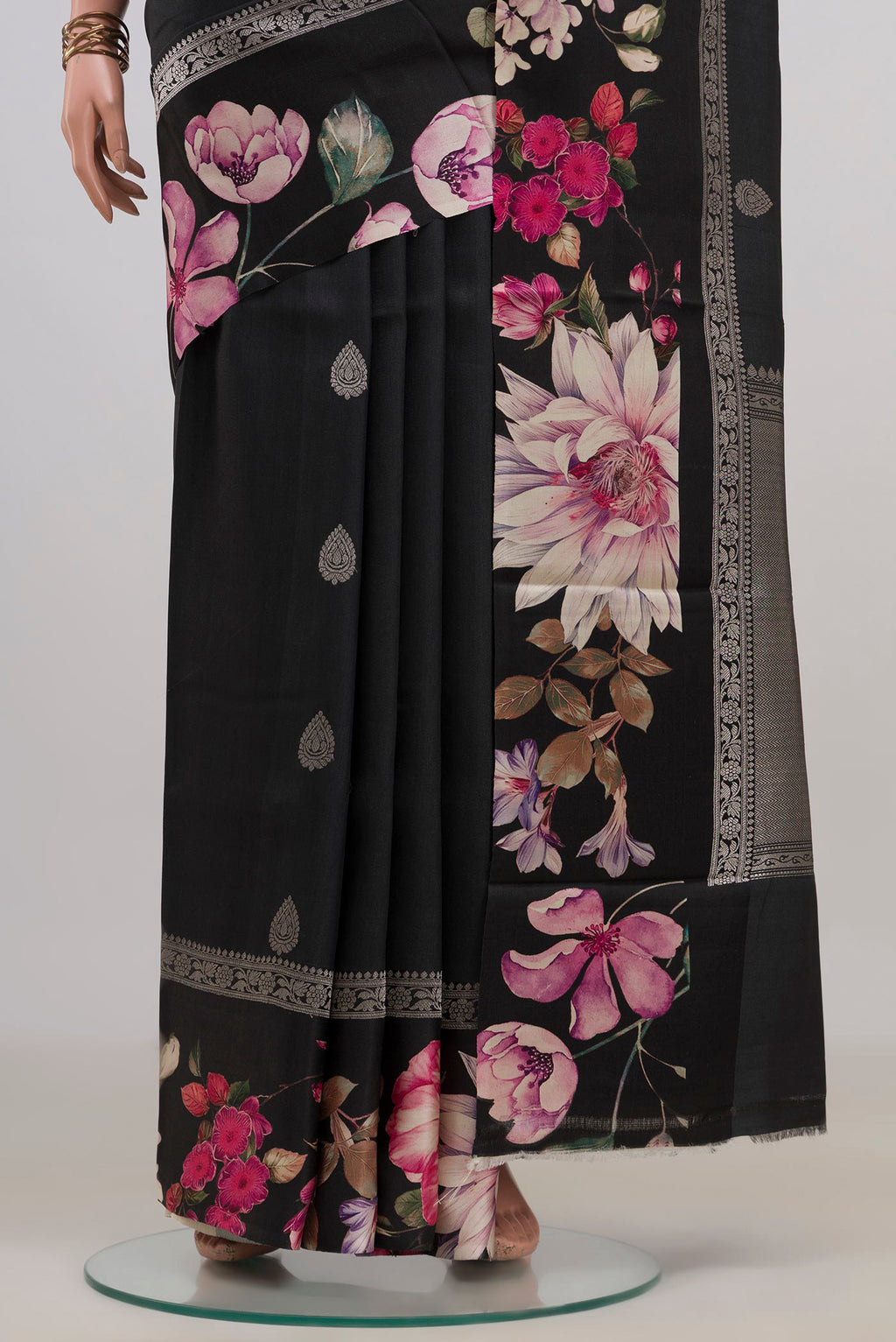 Pleats and pallu of Black Tussar Saree with Zari Butta on the body and Fancy Border. 