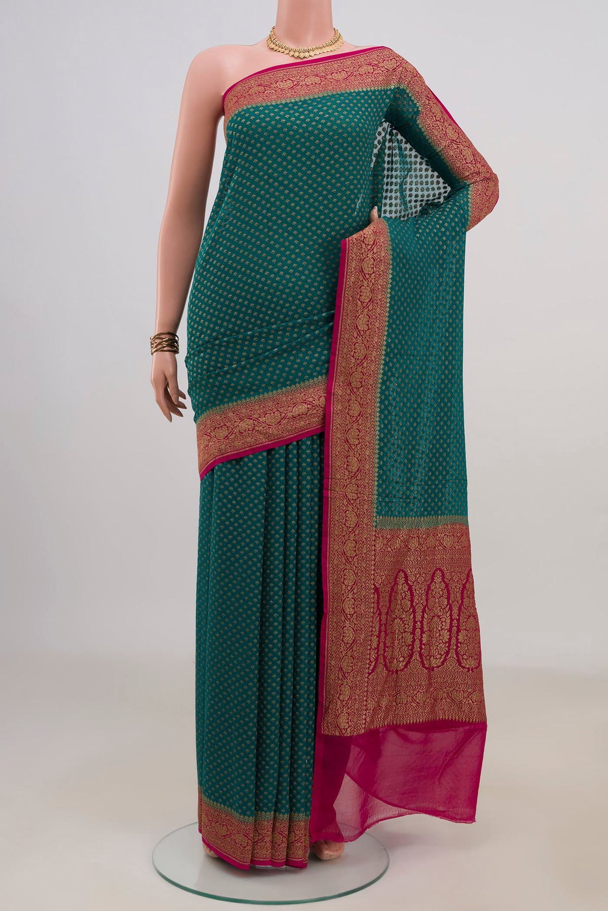 Blue Banarasi Georgette Saree with Zari Butta on the body and Fancy Border.  displayed on a mannequin