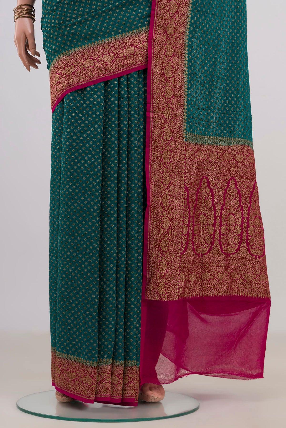 Pleats and pallu of Blue Banarasi Georgette Saree with Zari Butta on the body and Fancy Border. 