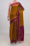 Pure Silk Mustard Soft Saree with Zari Butta on the body and Fancy Border.  displayed on a mannequin