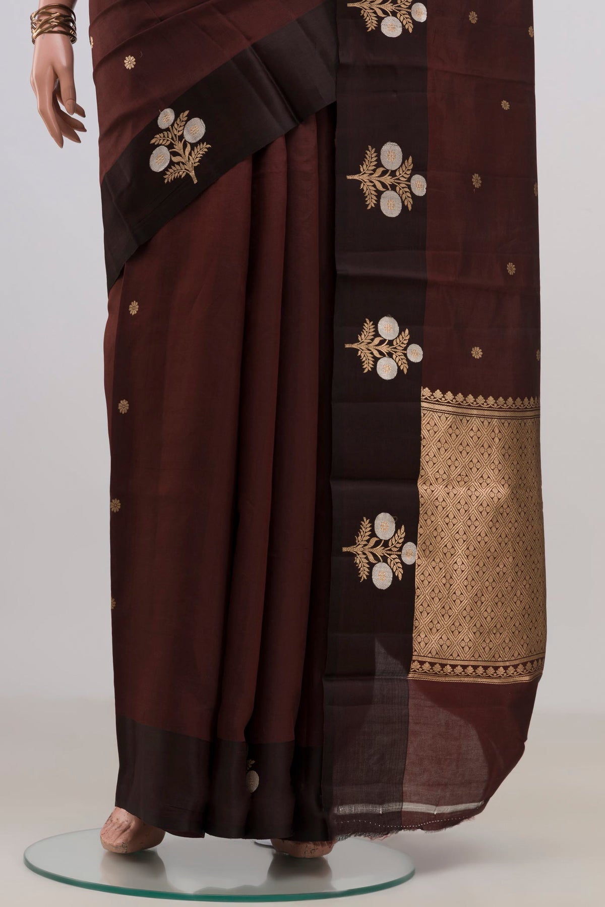 Pleats and pallu of Pure Silk Coffee Brown Banarasi Katan Saree with Zari Butta on the body and Fancy Border. 