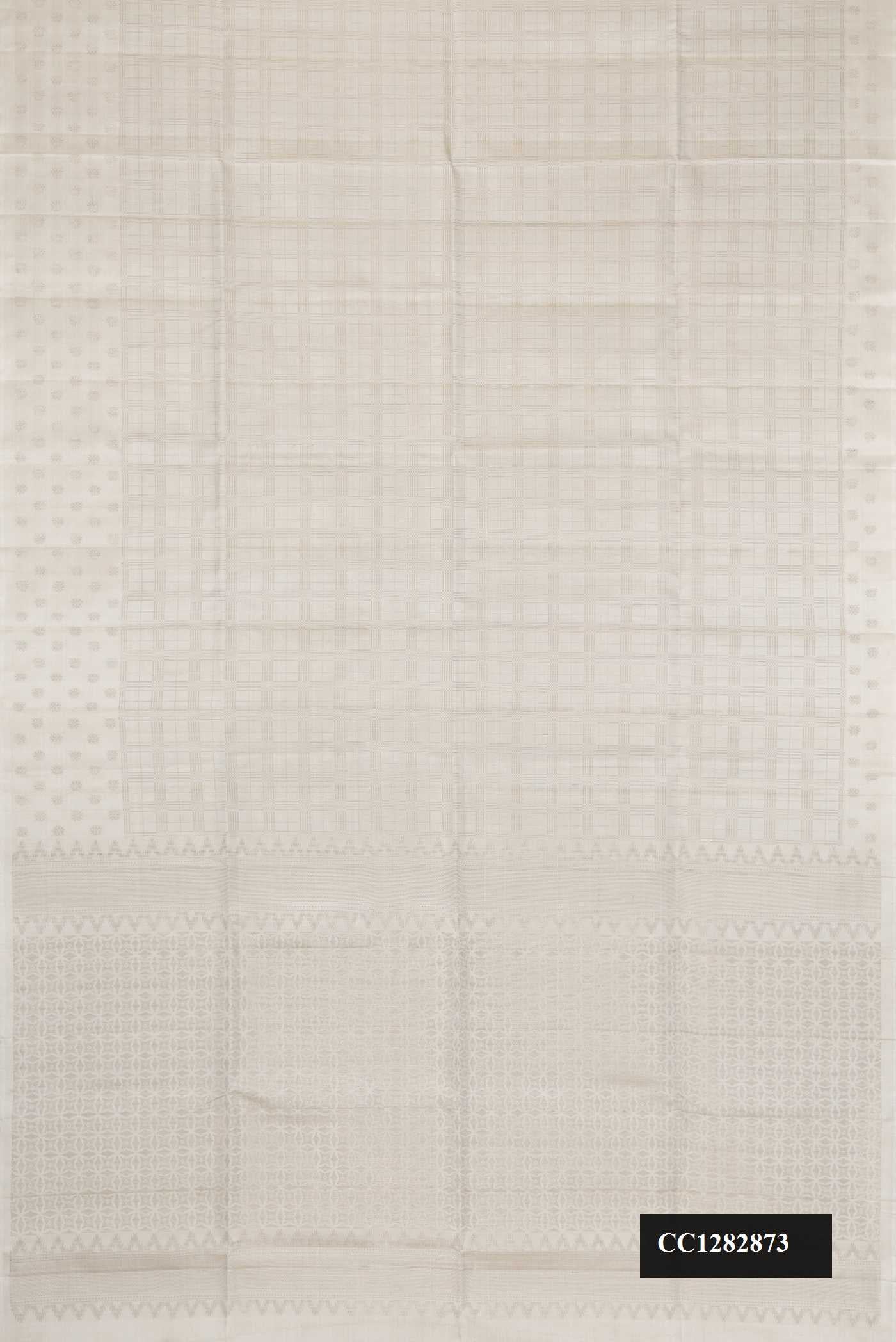 Off White Dual Tone Soft Silk Saree with Zari Brocade on the body and Zari Border.  displayed on a mannequin