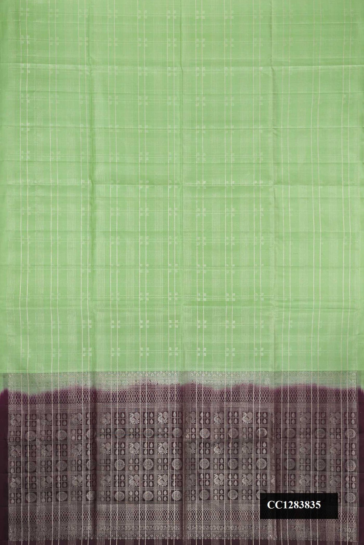 Pista Green Dual Tone Soft Silk Saree with Checked design on the body and Without Border.  displayed on a mannequin