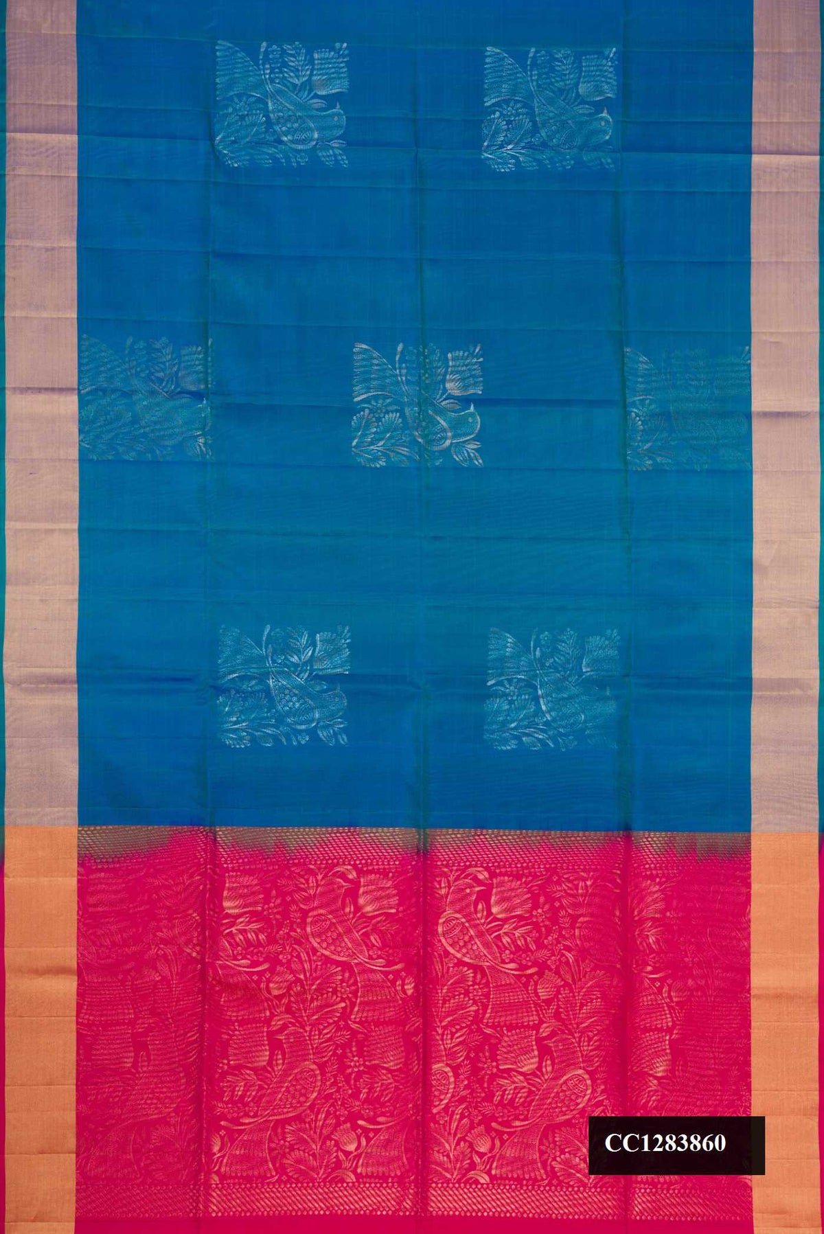 Peacock Blue Dual Tone Soft Silk Saree with Zari Butta on the body and Zari Border.  displayed on a mannequin