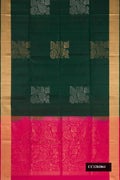 Bottle Green Dual Tone Soft Silk Saree with Zari Butta on the body and Zari Border.  displayed on a mannequin