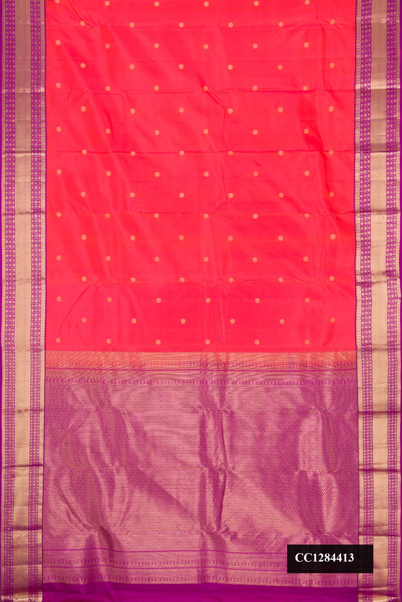 Orange Dual Tone Kanchipuram Silk Saree with Zari Butta on the body and Zari Border.  displayed on a mannequin