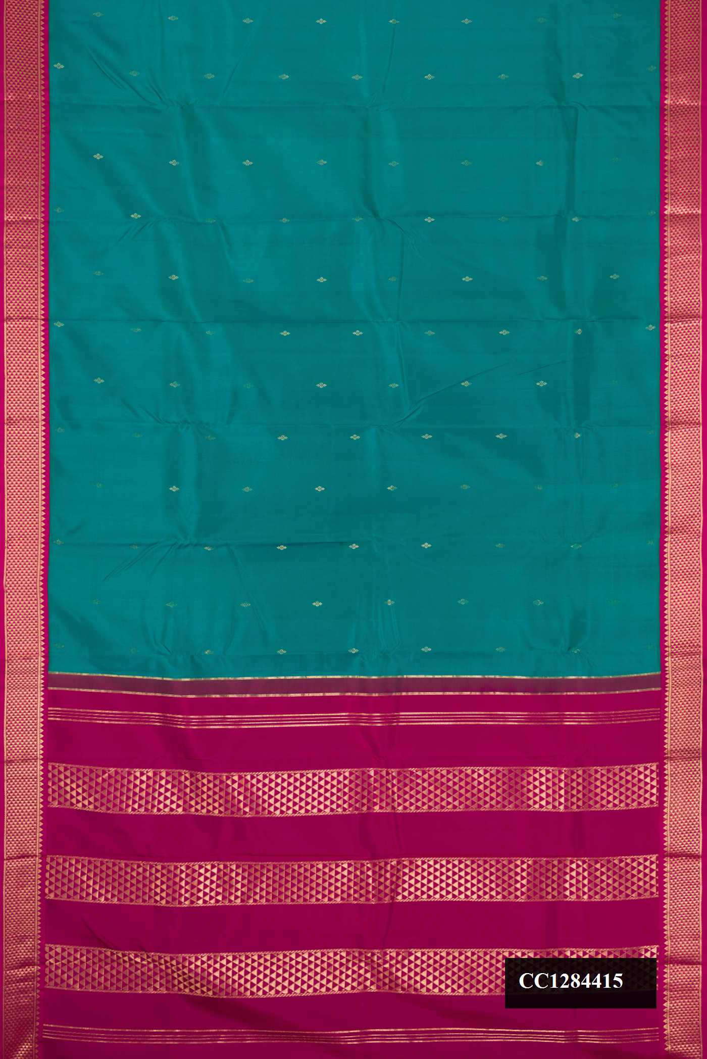 Green Dual Tone Kanchipuram Silk Saree with Zari Butta on the body and Zari Border.  displayed on a mannequin